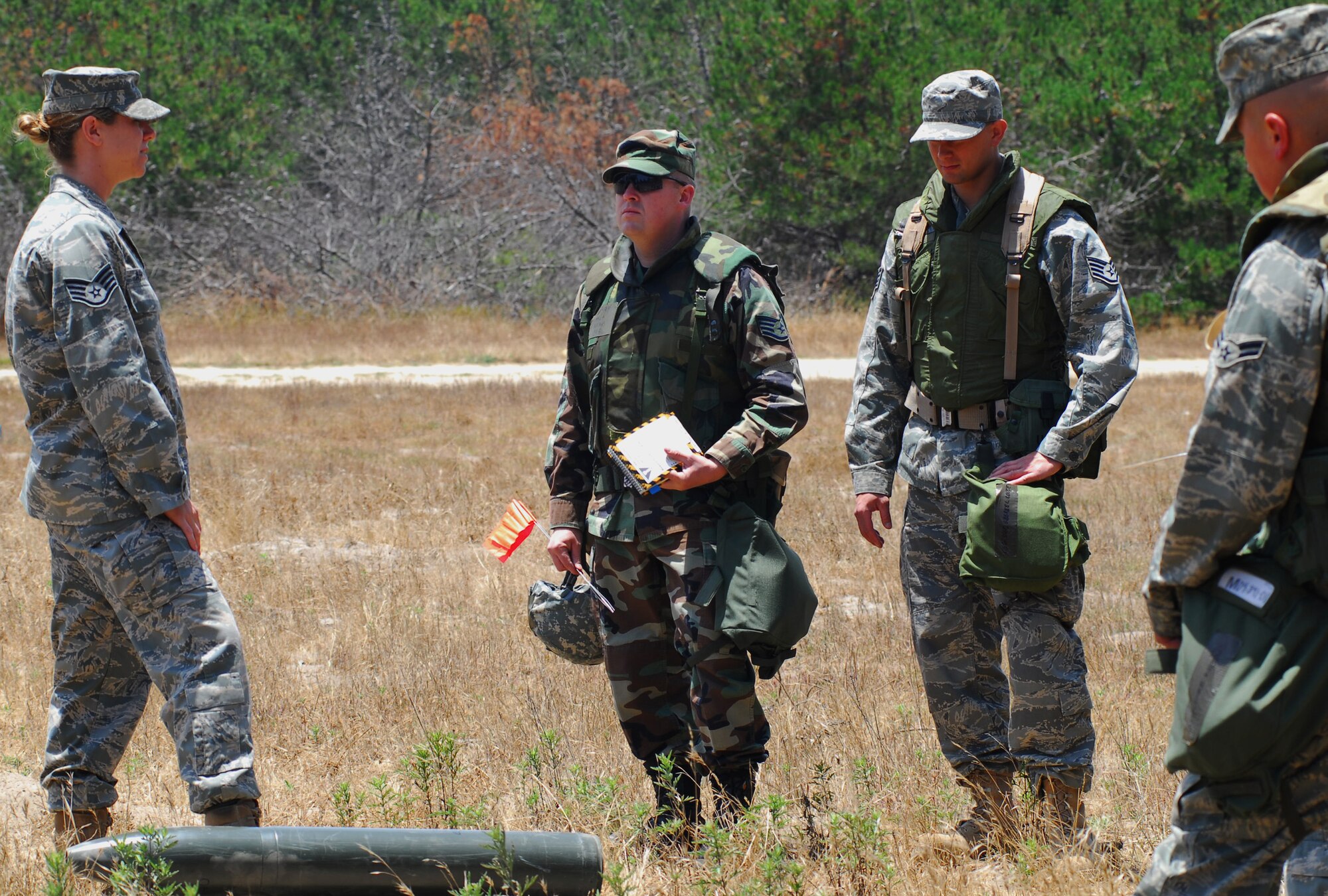 VANDENBERG AIR FORCE BASE, Calif. -- Members of team Vandenberg learn about an explosive ordnance device June 23 at Cocheo Park here during a North Star exercise. North Star is used to test each Airman's knowledge on self-aid and buddy care, force protection levels, terrorist attacks and many other situations that may arise in a deployed location as covered in the Airman's Manual. (U.S. Air Force photo/Airman 1st Class Kerelin Molina)