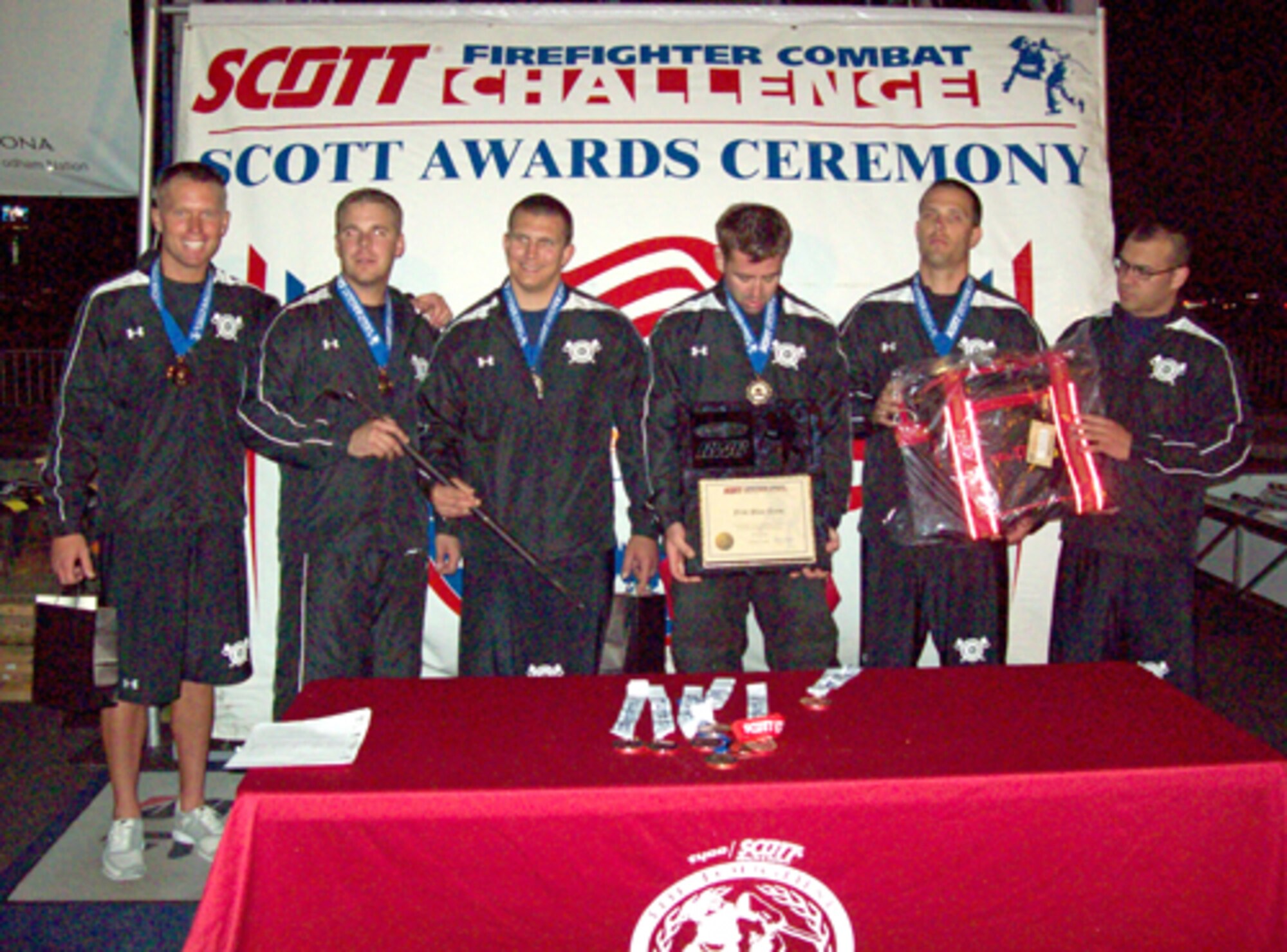 Peterson Air Force Base Fire Department firefighters earned accolades by placing second in the relay portion and second in individual as a team portion of the Scott Firefighter Combat Challenge, a regional qualifier competition held in Tucson, Ariz, June 16. From left to right: Senior Airman John Dannen, Staff Sgt. Nick Hall, Staff Sgt. Brian Burmeister, Staff Sgt. Jimmy Welch, Staff Sgt. Joe Absher, and Senior Airman Chris Ingle. (Air Force photo)


