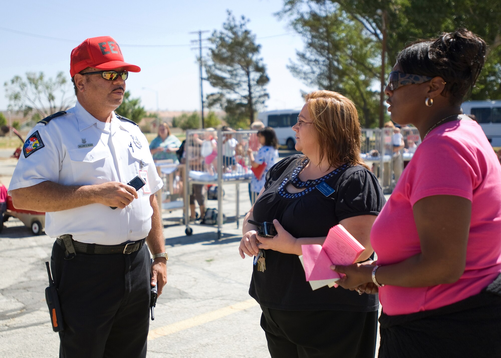 Mary Acklin(center), Child Development Center director and Tracey Taylor(right), CDC clerk, discuss the CDC's evacuation drill with William Redick, fire protection training specialist, during an emergency management exercise June 23. The exercise tested the capability of base personnel to react to a crisis. (Air Force photo by Heather Anhalt)
