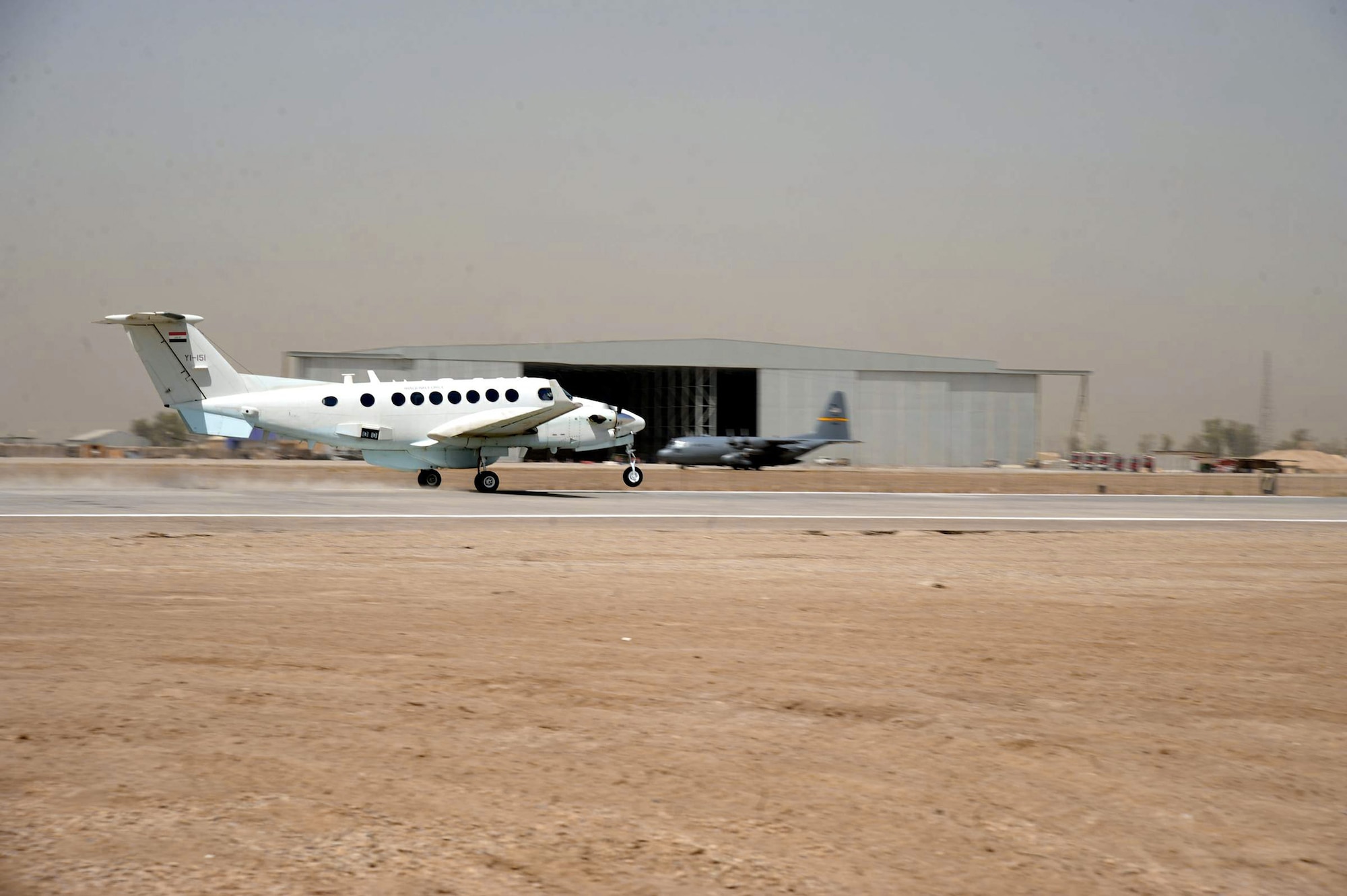 An Iraqi King Air 300 takes off on a refurbished runway  June 16 at Sather Air Base, Iraq. The aircraft was the first to test out the revamped runway. The completion of runway repairs wrapped up the first stage of an estimated 15-month, 11-phase, $33 million airfield rehabilitation project. (U.S. Air Force photo/Staff Sgt. Amanda Currier) 

