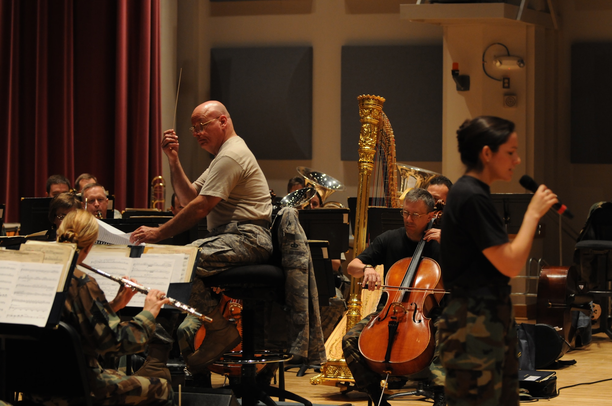 Col. Dennis M. Layendecker, United States Air Force Band commander, conducts rehearsal June 25 in Hangar One at Bolling Air Force Base, D.C. Colonel Layendecker will retire this summer and relocate to George Mason University as the heritage chair in music and director of university orchestras in the College of Visual and Performing Arts. (U.S. Air Force photo by Senior Airman Marleah Miller)