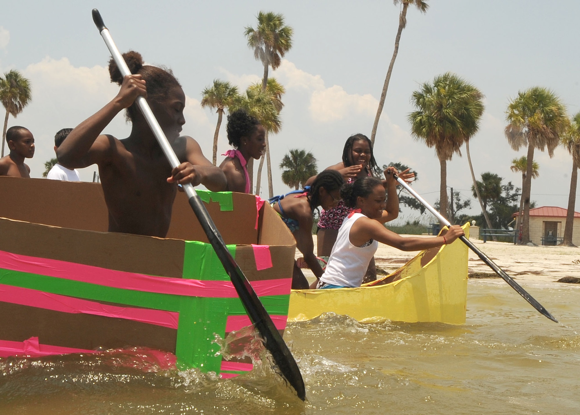 Drug Education For Youth  Program (DEFY) campers test their skills in the water during the DEFY boat regatta on june 10 2009. DEFY campers and mentors must build a boat using only, cardboard, duct tape and paint.  (U.S. Air Force photographer Senior Airman David Minor)