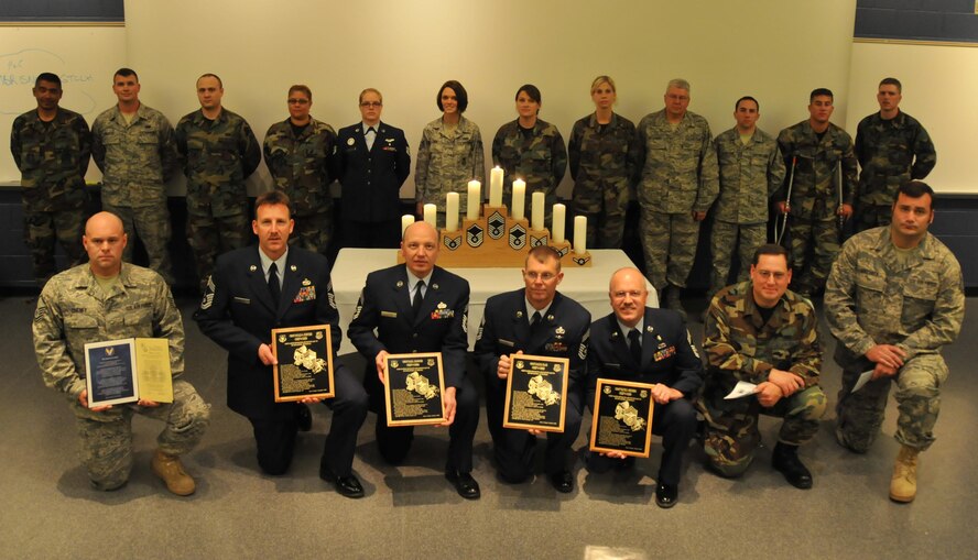 Newly promoted NCOs, senior NCOs and chiefs are congratulated on their achievements at the NCO recognition ceremony June 6. (Air Force Photo/Tech. Sgt. Bob Sommer)