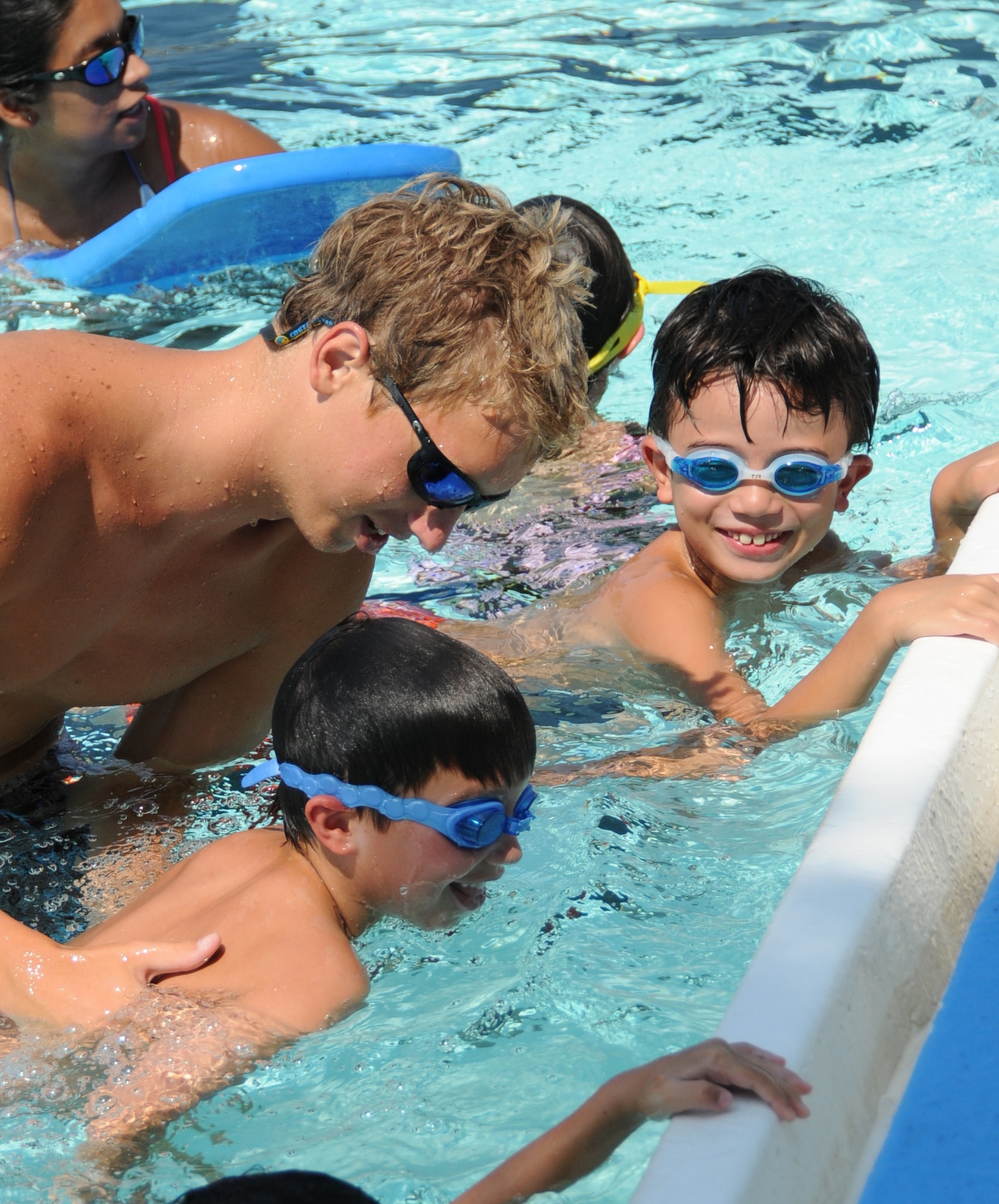 Lifeguard Allan Pearson works with Dalton Burgess, 6, and Noah Kelly, 8, during swimming lessons at the main base pool, Tuesday.  Their parents are John and Sunshine Burgess, 334th Training Squadron, and Joshua and Yukiko Kelly, Center for Naval Aviation Technical Training Unit.  The main base pool reopened Tuesday, noon to 5:30 p.m. daily except Monday.  The Triangle Pool is open noon to 7 p.m. daily except Wednesday, with lap swimming for adults, 11 a.m. to noon.  Single and family passes are available.  For more information, call the main base pool, 377-3948, and the Triangle Pool, 377-3568.  (U.S. Air Force photo by Kemberly Groue)