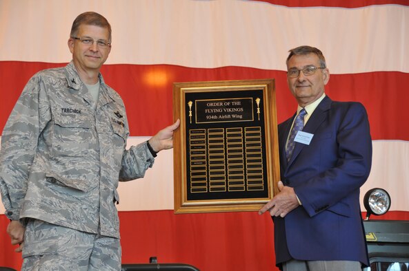 Col. Tim Tarchick recognizes Mr. Bob Kirschner as the newest recipient of the Order of the Flying Viking.  The honor is given to community members  for outstanding support of  the men and women of the 934th Airlift Wing. (Air Force Photo/Tech. Sgt. Bob Sommer)
