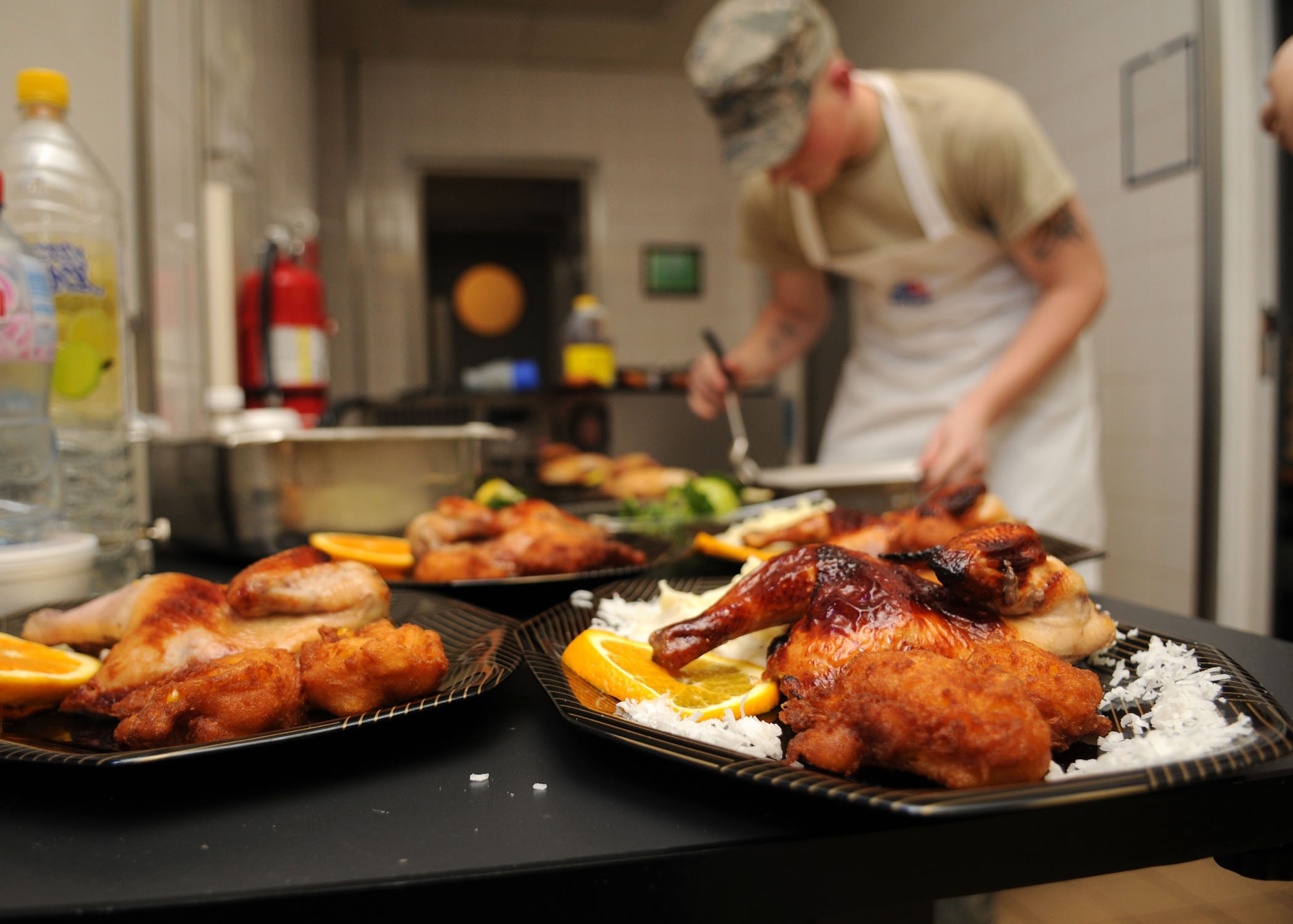 Airman 1st Class Michael Voutila, 100th Force Support Squadron, completes one of four plates while adding final touches during the Top Chef Challenge at the dining facility June 17, 2009, at RAF Mildenhall, England. (U.S. Air Force photo by Staff Sgt. Jerry Fleshman)