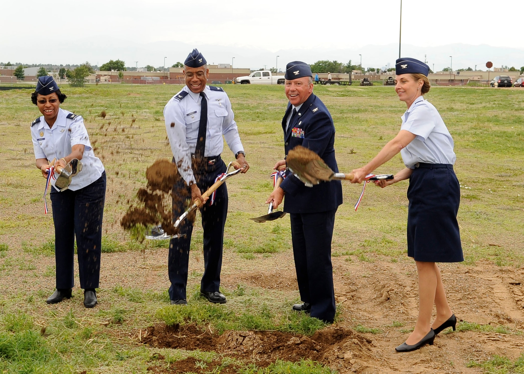 BUCKLEY AIR FORCE BASE, Colo. – Colonels Charlotte Wilson, 460th Space Wing vice commander, Charles Campbell, Air Force Space Command Surgeon General, Michael Chyrek, 460th Medical Group commander and Kirsten Watkins, 460th Medical Support Squadron commander break ground for a new pharmacy during an official ceremony  here, June 15.  The pharmacy, currently located off base, is one of many projects being constructed on base.  (U.S. Air Force photo by Senior Airman Steven Czyz)