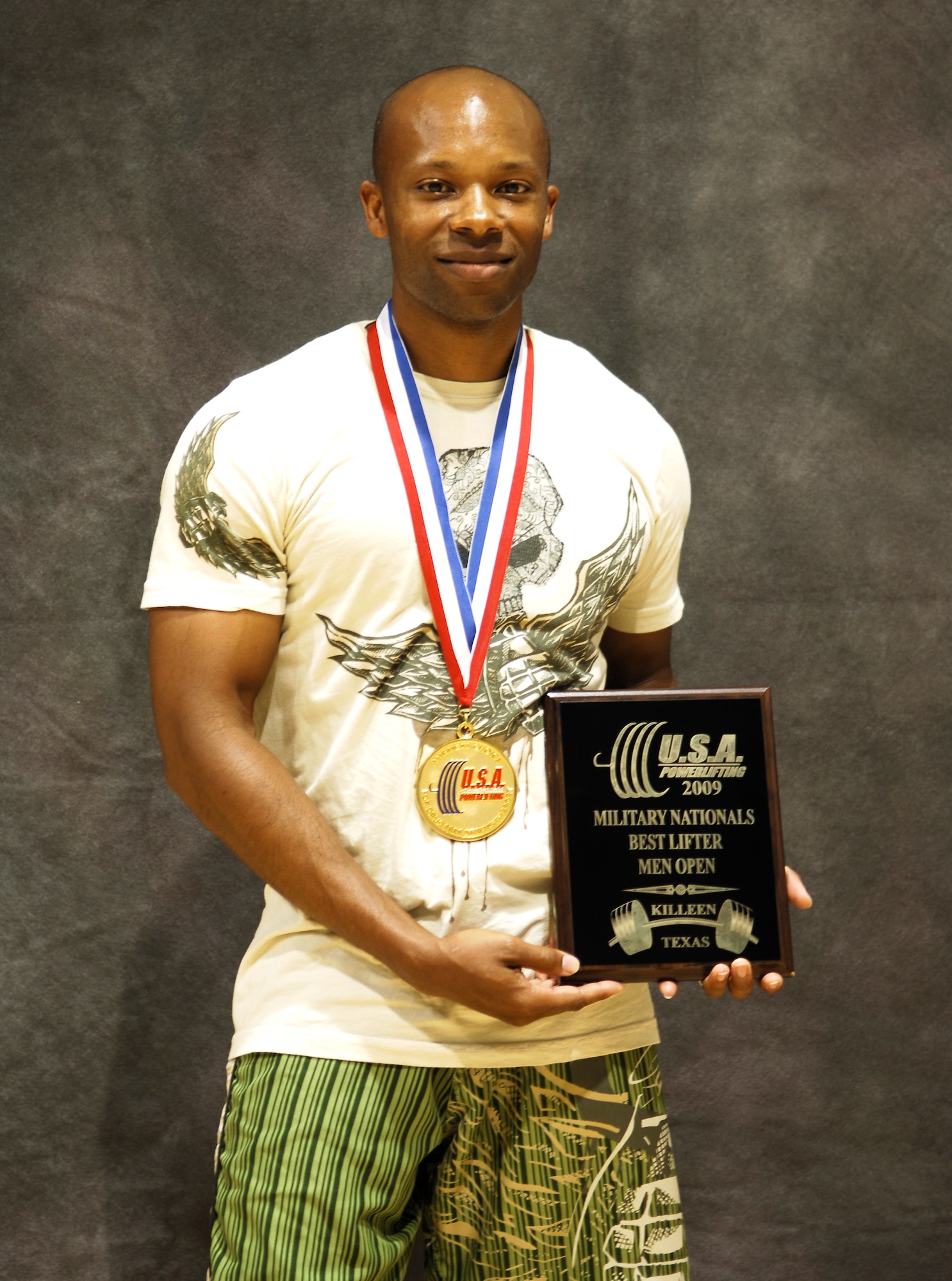 Staff Sgt. Bobby Harrison, 505th Training Squadron, shows off his hardware he won at the national military powerlifting competition in Killeen, Texas. Sgt. Harrision lifted a total of 1,140 pounds in the bench press, squat and deadlift exercises (US Air Force photo/Senior Airman Shiela DeVera).