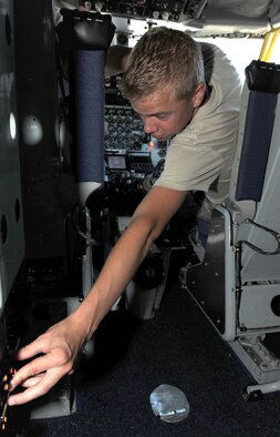 Airman 1st Class Theodore Ehrhorn, 916th Aircraft Maintenance Squadron guidance control specialist, engages the built-in test switch in a KC-135 Stratotanker on Seymour Johnson Air Force Base, N.C., June 24, 2009. The built-in test switch checks electronic components to make sure their functioning inside the cockpit. (U.S. Air Force photo by Airman 1st Class Gino Reyes)