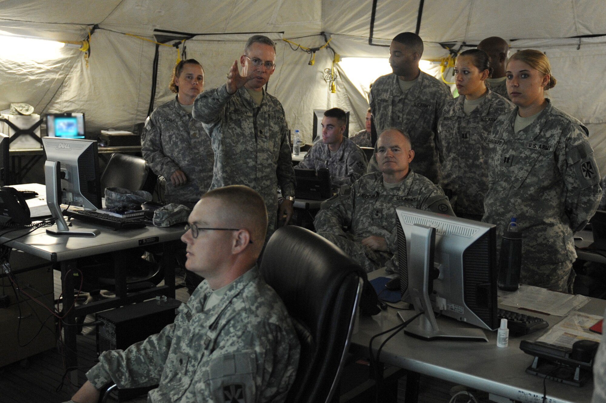 SOUTHWEST ASIA - Maj. Gen. Charles Anderson, Deputy Commanding General, U.S. Army Central, is briefed at the tactical control center for the 5-52 Air Defense Artillery Battalion's Patriot Battery site, June 23 at an undisclosed location in Southwest Asia. General Anderson was here to view the unit's Patriot Missile Battery and be briefed on its mission while also recognizing some of the Army's top performers. (U.S. Air Force photo by Senior Airman Brian J. Ellis) (Released)