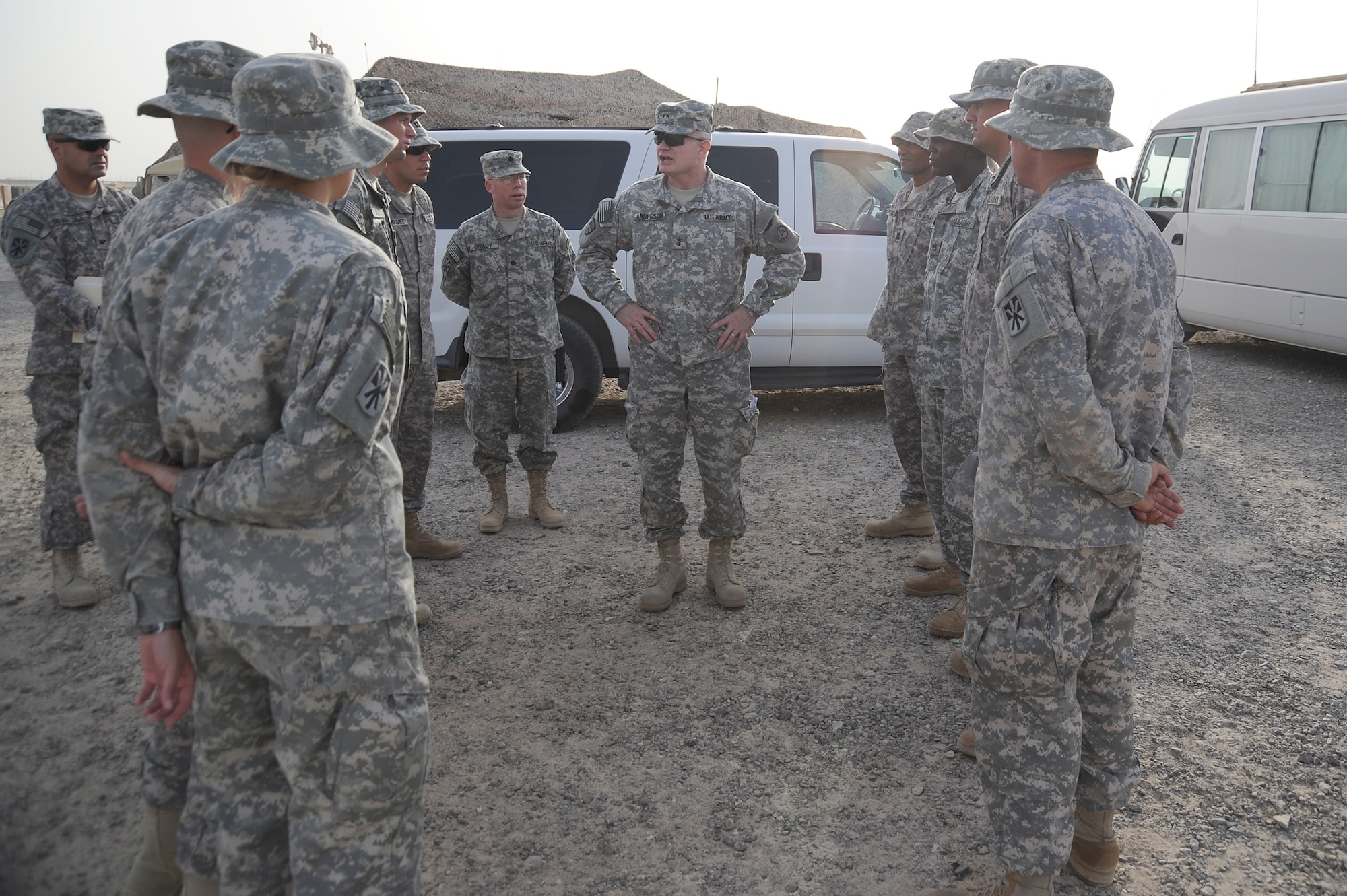 SOUTHWEST ASIA -- Maj. Gen. Charles Anderson, Deputy Commanding General, U.S. Army Central, talks with soldiers from the 5-52 Air Defense Artillery Battalion at a Patriot Battery site, June 22 at an undisclosed location in Southwest Asia. General Anderson was here to view the unit's Patriot Missile Battery and recognize some of the Army's top performers. (U.S. Air Force photo by Senior Airman Brian J. Ellis) (Released)