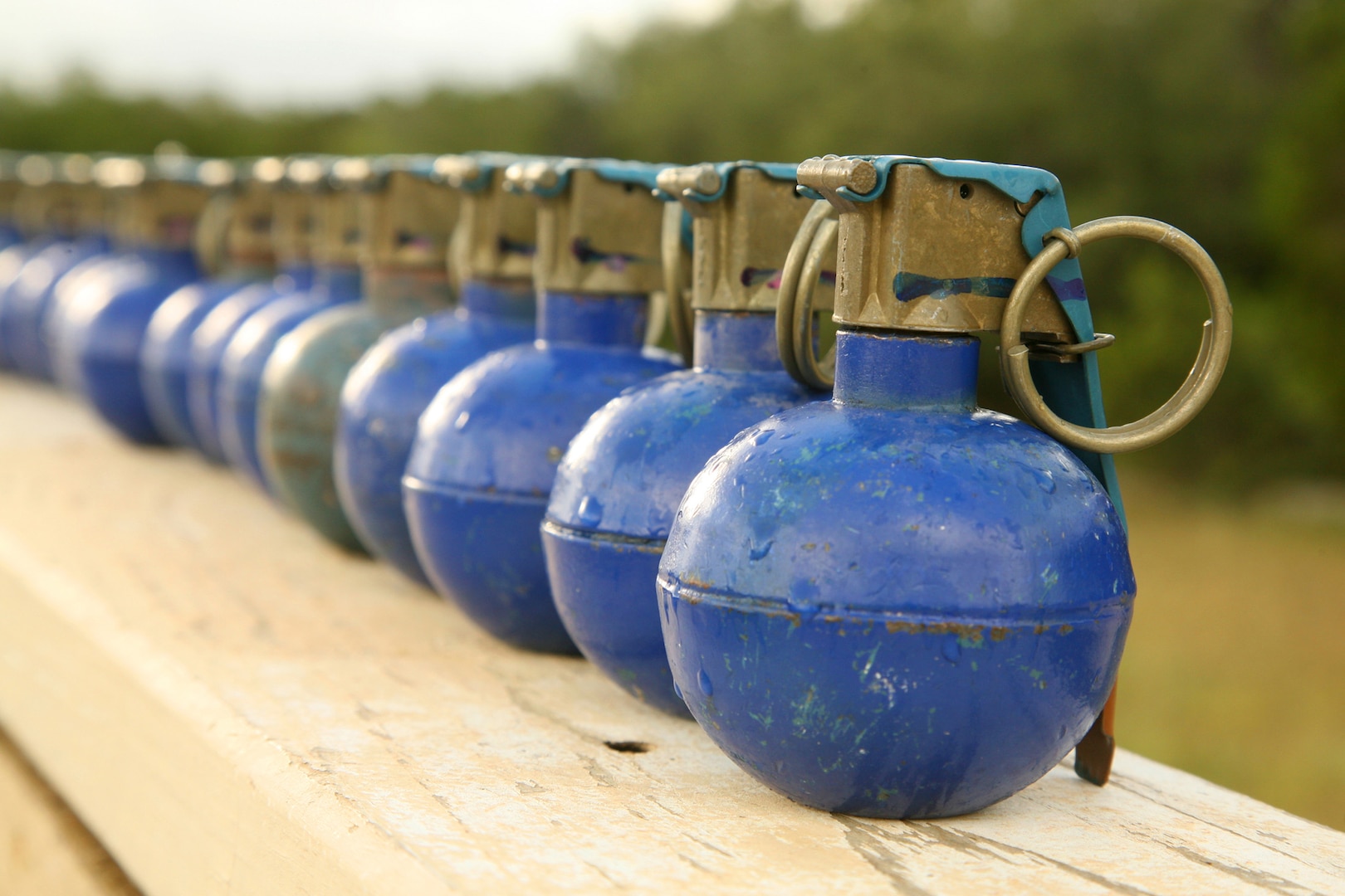 A row of M-67 training grenades sit on a bay ledge June 18 at Camp Bullis, Texas. (U.S. Air Force photo/Robbin Cresswell)

