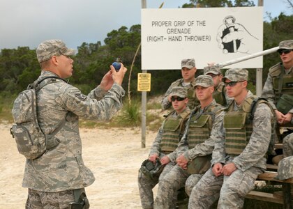 Staff Sgt. John Plemons gives a lecture on employing the M-67 hand grenade June 18 at Camp Bullis, Texas.  The Security Forces Basic Officers' Course students practice throwing simulated grenades before moving on to live ordnance.  Sergeant Plemons is an instructor with the 343rd Training Squadron. (U.S. Air Force photo/Robbin Cresswell)
