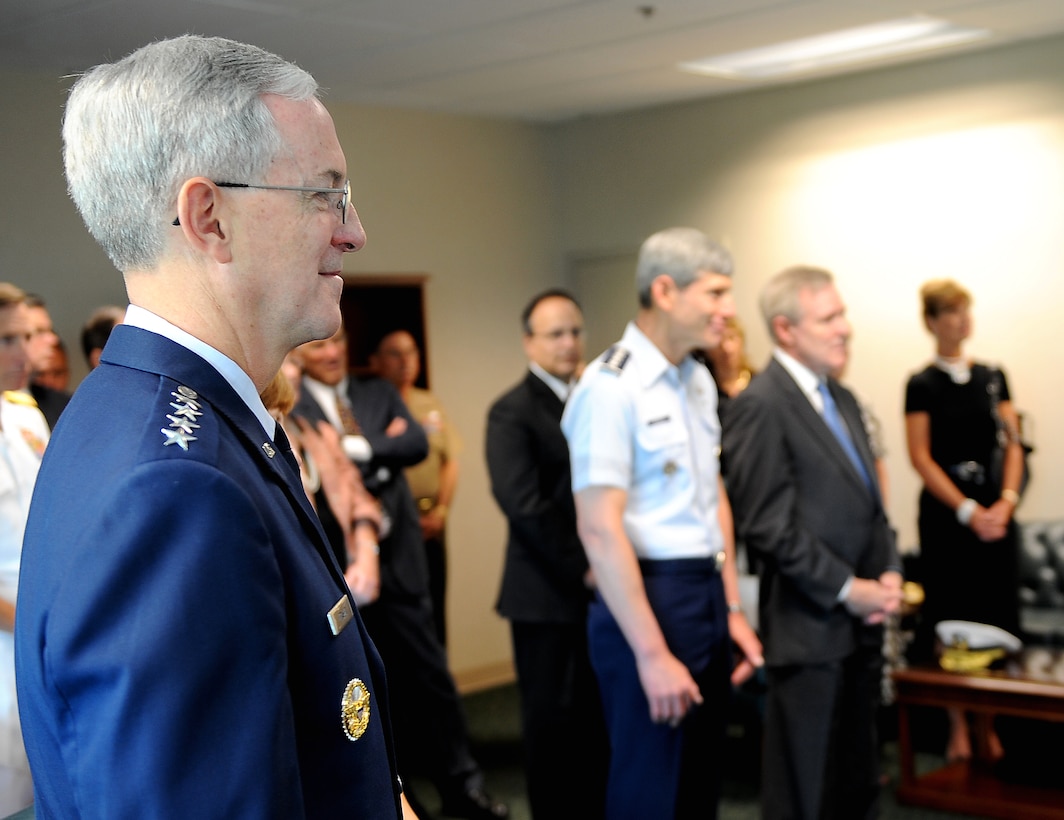 Air Force Gen. Douglas M. Fraser, incoming commander of Southern Command, looks on as Navy Adm. James G. Stavridis receives accolates before the change of command ceremony at Southern Command Headquarters in Miami, Fla., June 25, 2009.