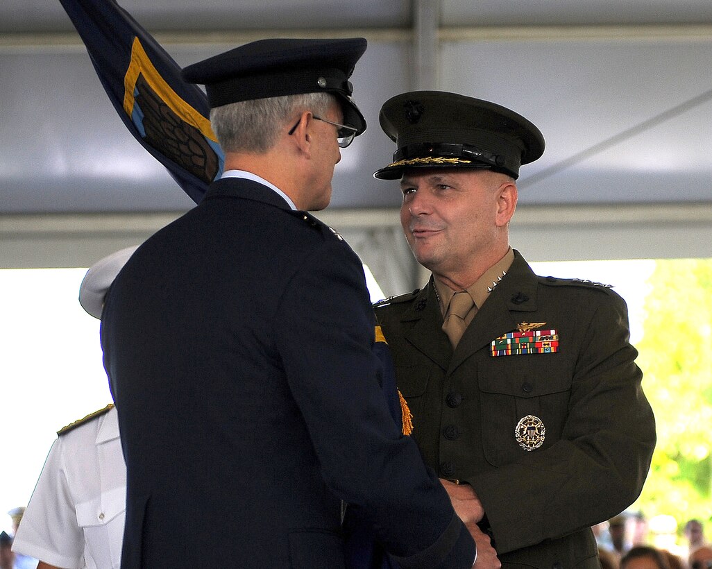 Marine Gen. James E. Cartwright, vice chairman of the Joint Chiefs of Staff, passes command to Air Force Gen. Douglas M. Fraser as he takes over as commander of Southern Command in Miami, Fla., June 25, 2009.