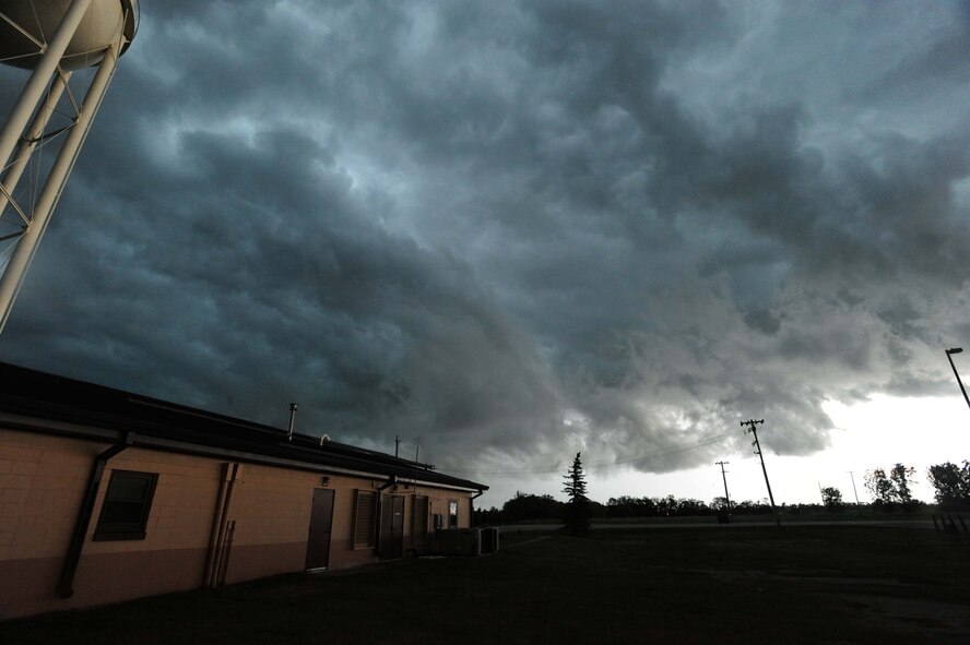 As the clouds swelled over Grand Forks Air Force Base and the Grand Forks region, members of the Incident Control Center leapt into action to protect Airmen and their families, as well as mitigate damage to property caused by tornadic activity and lightning strikes. Not long after sounding the tornado warning sirens and notifying the base community, a tornado was spotted less than 20 miles southeast of the base. (U.S. Air Force photo/Tech. Sgt. Johnny Saldivar)