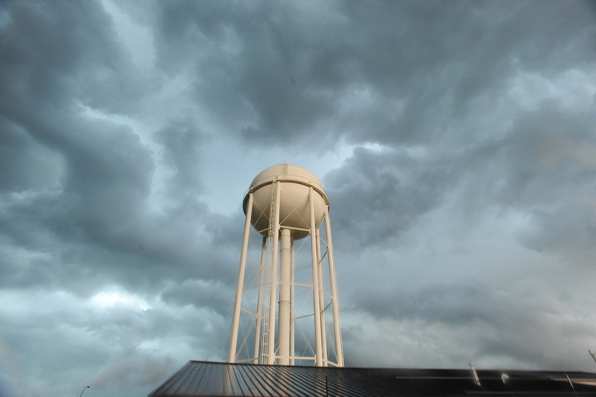 As the clouds swelled over Grand Forks Air Force Base and the Grand Forks region, members of the Incident Control Center leapt into action to protect Airmen and their families, as well as mitigate damage to property caused by tornadic activity and lightning strikes. Not long after sounding the tornado warning sirens and notifying the base community, a tornado was spotted less than 20 miles southeast of the base. (U.S. Air Force photo/Tech. Sgt. Johnny Saldivar)