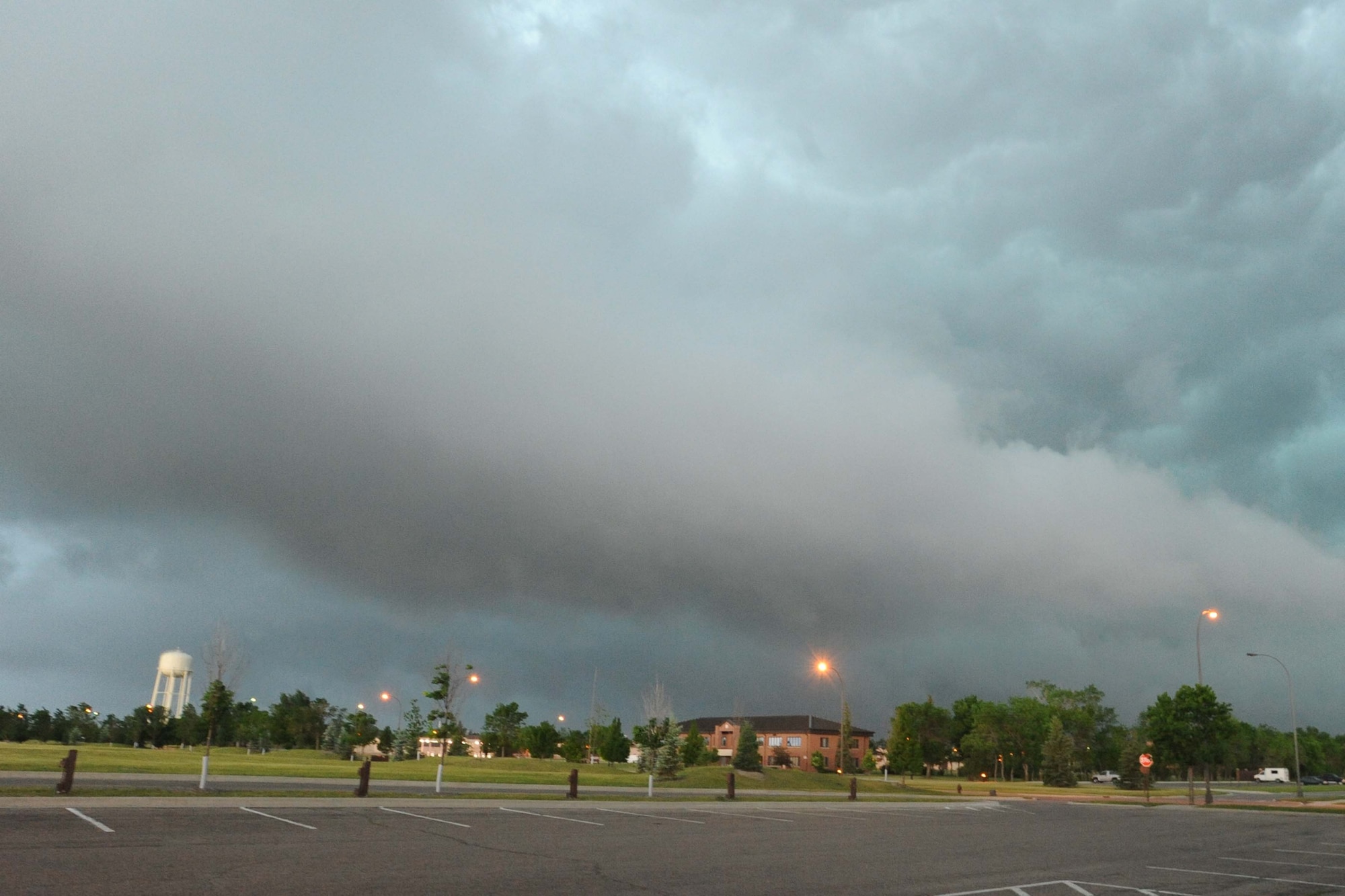 As the clouds swelled over Grand Forks Air Force Base and the Grand Forks region, members of the Incident Control Center leapt into action to protect Airmen and their families, as well as mitigate damage to property caused by tornadic activity and lightning strikes. Not long after sounding the tornado warning sirens and notifying the base community, a tornado was spotted less than 20 miles southeast of the base. (U.S. Air Force photo/Tech. Sgt. Johnny Saldivar)