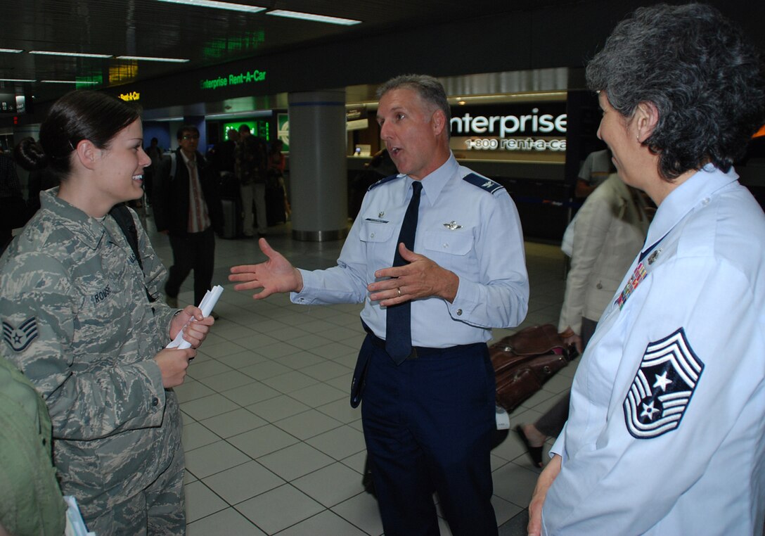Staff Sgt. Alisha Rouse is welcomed back from a deployment overseas by Col. John "Jay" Flournoy, Jr., commander of the 932nd Airlift Wing, and Command Chief Master Sgt. Sandra Santos, who enjoy greeting their returning wing members.  (U.S. Air Force photo/Maj. Stan Paregien)