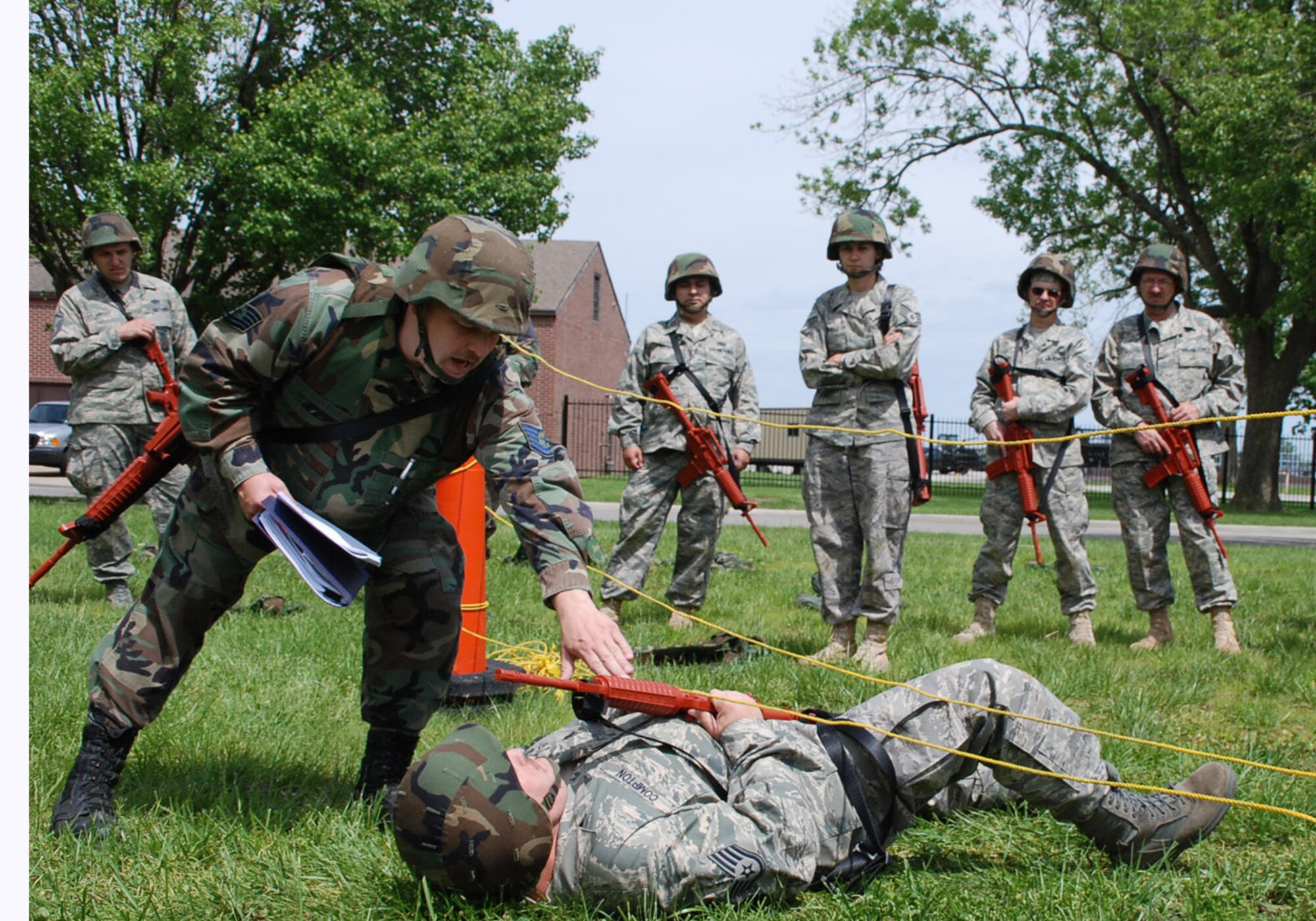 A 932nd Airlift Wing civil engineer instructor teaches Air Force Reservists what to do to help out a fallen comrade during the unit drill training at Scott Air Force Base. First aid and buddy care are taught to all wing members.  (U.S. Air Force photo/Tech. Sgt. Dan Oliver)