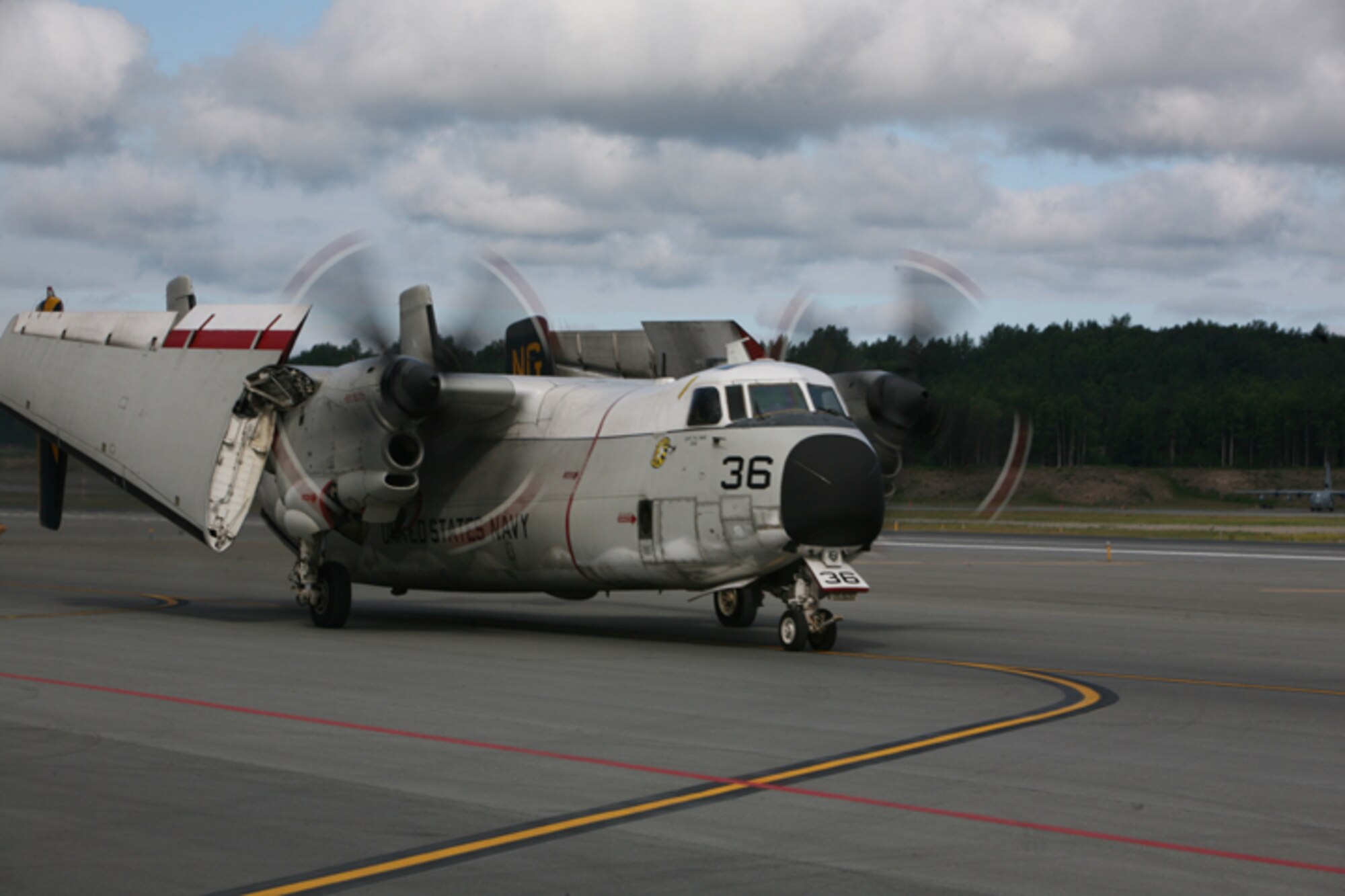 ELMENDORF AIR FORCE BASE, Alaska -- A C-2A Greyhound flown by Navy Fleet Logistics Support Squadron 30 taxies down the flightline here June 19. The Greyhound was responsible for "carrier onboard delivery" flights, or COD, during Northern Edge 2009. Northern Edge is a joint training exercise that incorporates 9,000 servicemembers, including those on board the USS John C. Stennis (CVN 74) aricraft carrier. (U.S. Air Force photo/Marine Corps Sgt. Zachary Dyer)