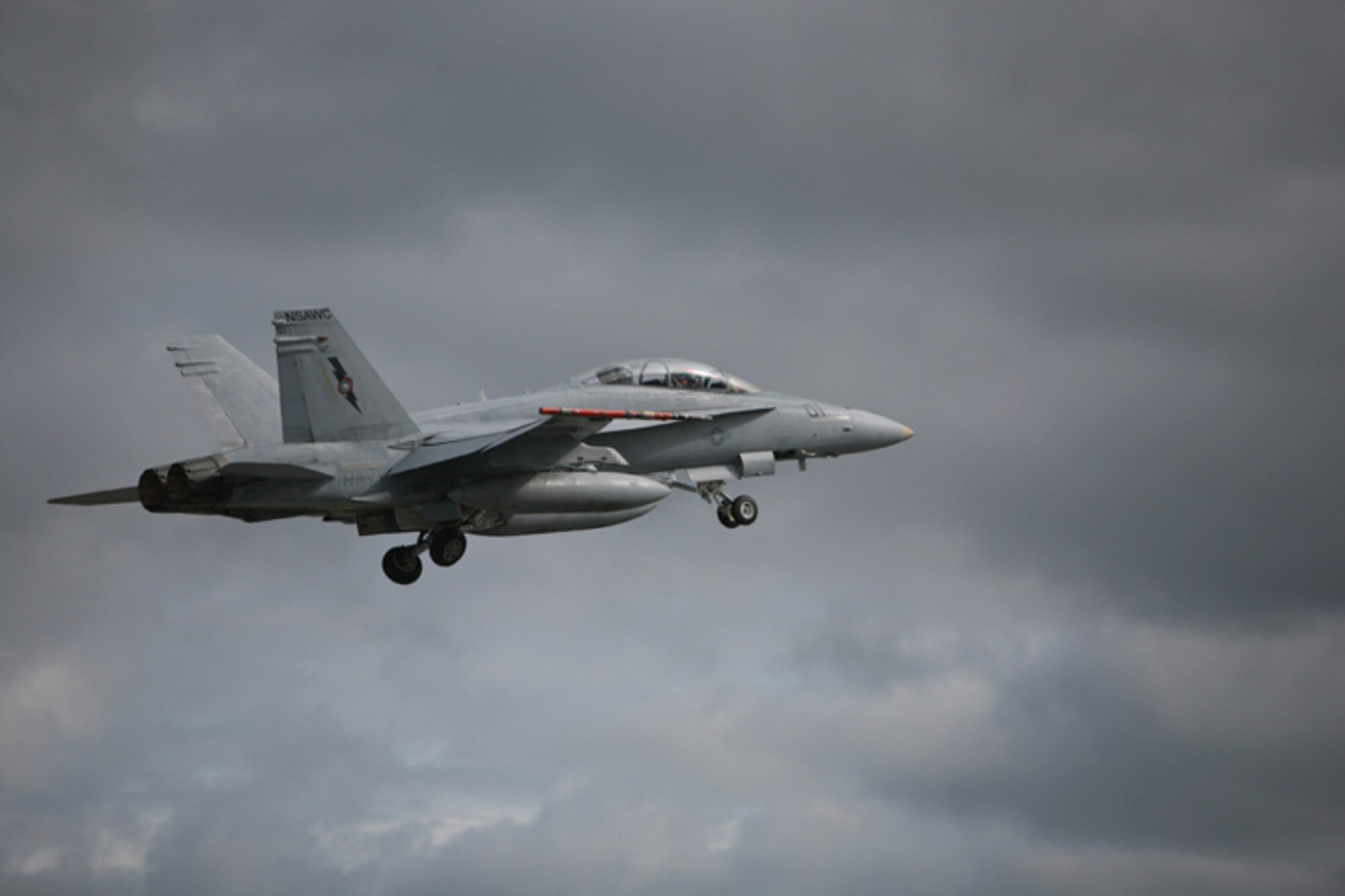 ELMENDORF AIR FORCE BASE, Alaska -- A Navy F/A-18D Hornet from the Naval Strike Air Warfare Center powers through the Alaskan skies on its way to a Northern Edge 2009 training mission June 19. Northern Edge was a joint training exercise that took place at the Joint Pacific Alaska Range Complex and in the Gulf of Alaska June 15-26. (U.S. Air Force photo/Marine Corps Sgt. Zachary Dyer)