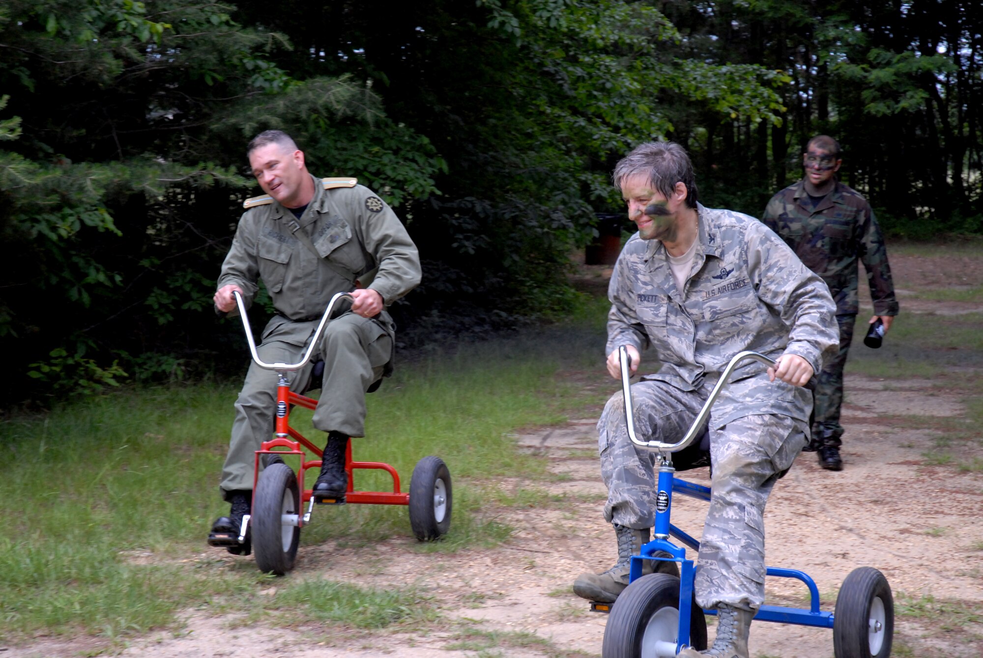 421st Combat Training Squadron Dining In guests, Colonels Randy Richert  and Jenny Pickett complete the grog bowel obstacle course at Joint Base McGuire-Dix-Lakehurst, N.J. June 12, 2009. The 421 CTS conducts multiple pre-deployment training courses to include AMC?s Phoenix Raven, Fly-Away Security Team training, and the Chief of Staff of the Air Force?s EAGLE FLAG exercise.  (U.S. Air Force Photo/Tech. Sgt. Paul R. Evans)