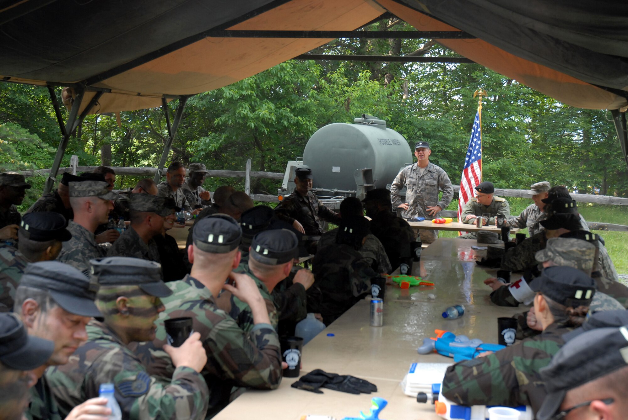 421st Combat Training Squadron Commander, Lt. Col. Mitchell Monroe, and president of the Mess, calls the Mess to order at the 421 CTS Combat Dining In on Joint Base McGuire-Dix-Lakehurst, N.J. June 12, 2009. The 421 CTS conducts multiple pre-deployment training courses to include AMC?s Phoenix Raven, Fly-Away Security Team training, and the Chief of Staff of the Air Force?s EAGLE FLAG exercise.  (U.S. Air Force Photo/Tech. Sgt. Paul R. Evans)