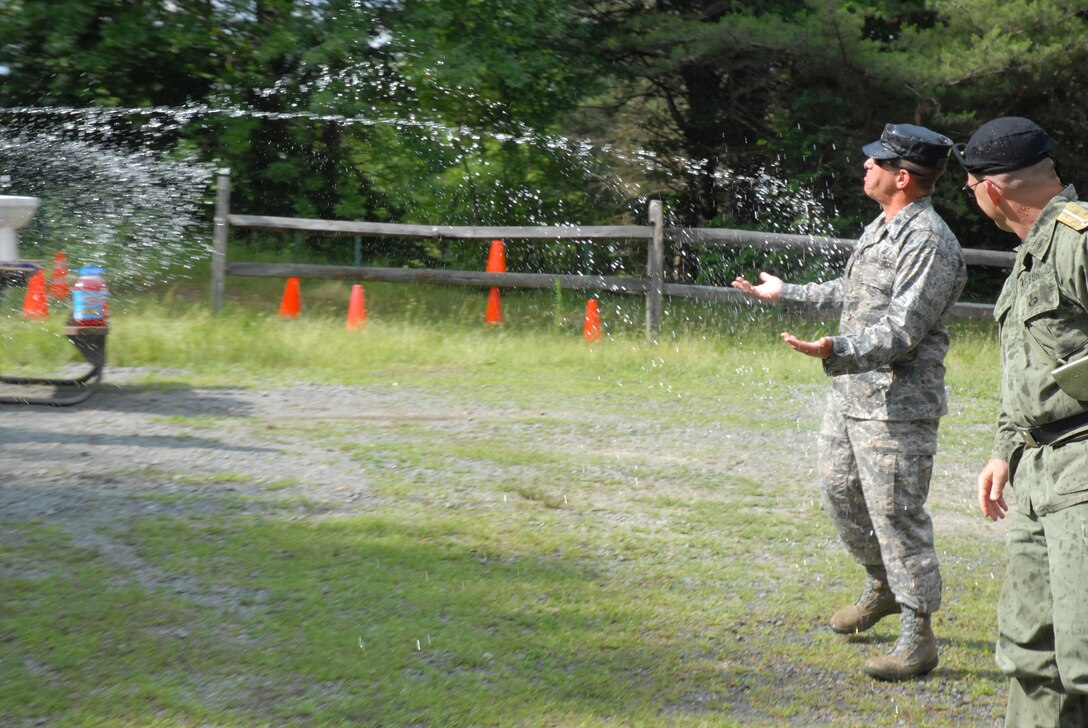 421st Combat Training Squadron Commander, Lt. Col. Mitchell Monroe, and special guest Col. Randy Richert receive a traditional 421 CTS Dining In welcome as they arrive as the official party at Joint Base McGuire-Dix-Lakehurst, N.J. June 12, 2009.  The 421 CTS conducts multiple pre-deployment training courses to include AMC?s Phoenix Raven, Fly-Away Security Team training, and the Chief of Staff of the Air Force?s EAGLE FLAG exercise.  (U.S. Air Force Photo/Tech. Sgt. Paul R. Evans)