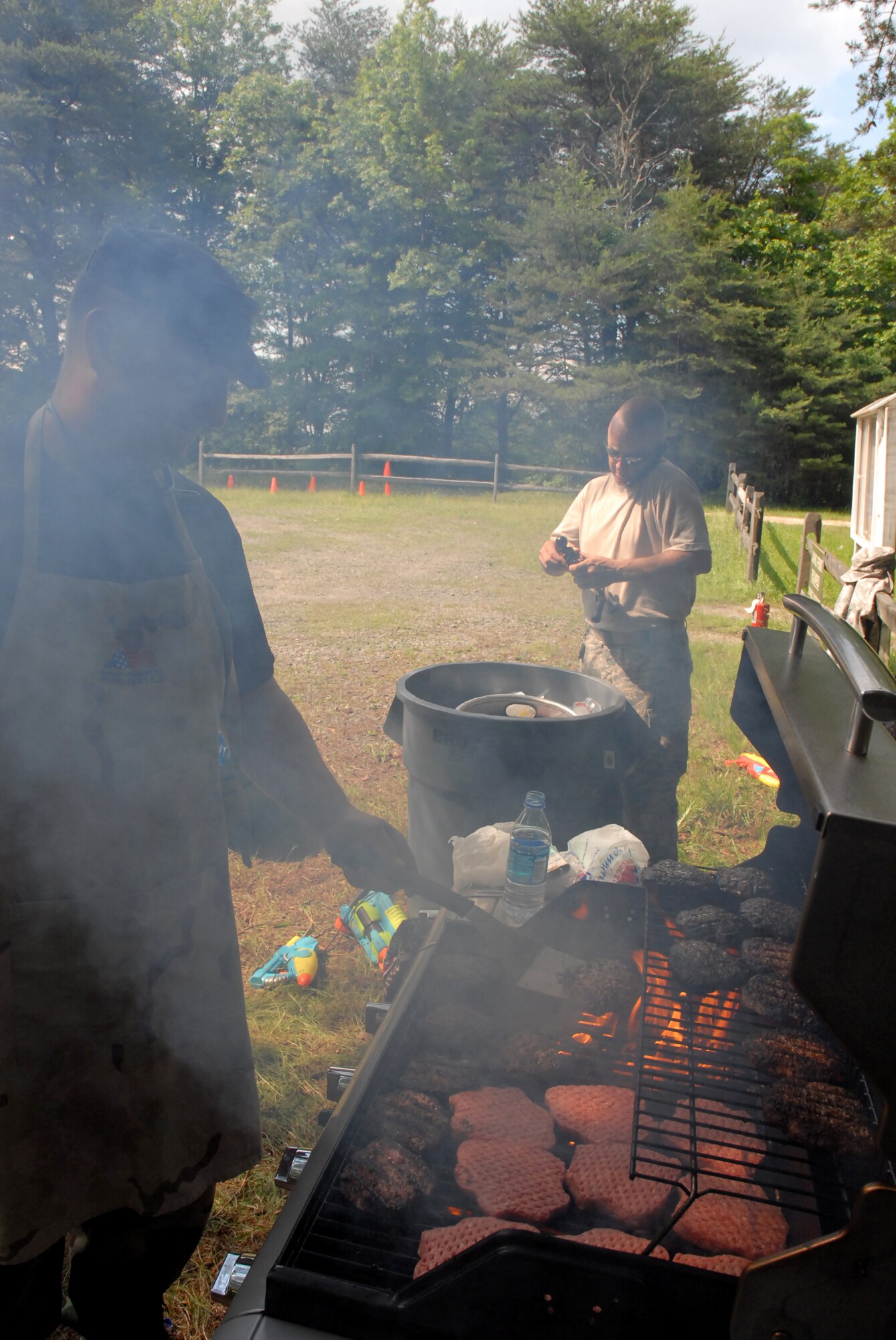 Tech. Sgt. Eric Morgan and Troy Colen prepare the food and beverages for the 421st Combat Training Squadron?s 2nd Annual Combat Dining In on Joint Base McGuire-Dix-Lakehurst, N.J. June 12, 2009.  The 421 CTS conducts multiple pre-deployment training courses to include AMC?s Phoenix Raven, Fly-Away Security Team training, and the Chief of Staff of the Air Force?s EAGLE FLAG exercise.  (U.S. Air Force Photo/Tech. Sgt. Paul R. Evans)