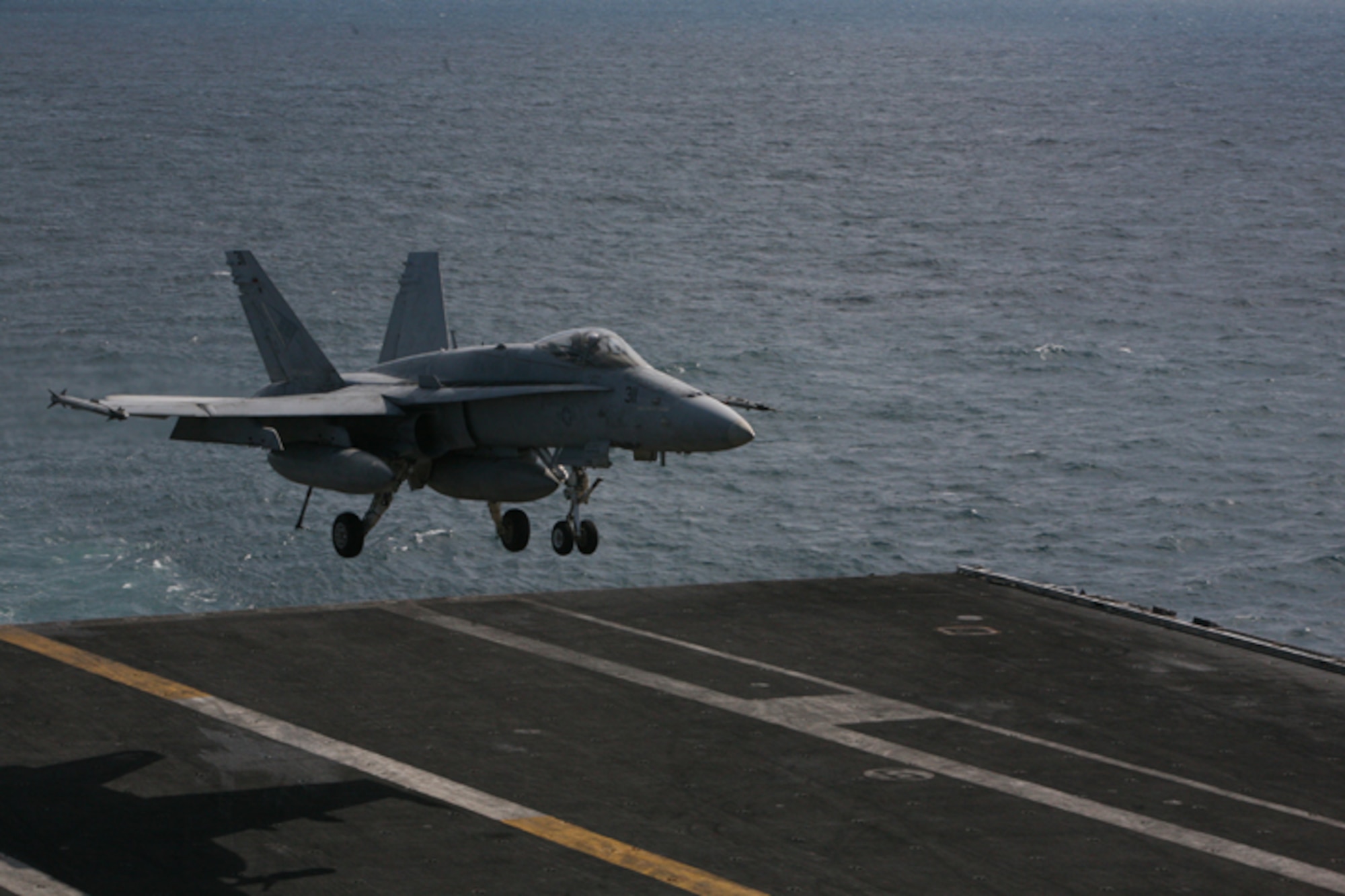 ELMENDORF AIR FORCE BASE, Alaska -- A F/A-18C flown by Navy Strike Fighter Squadron 146 comes in for an arrested carrier landing aboard the USS John C. Stennis (CVN 74) after completing a training mission for Northern Edge 2009 June 23. The Stennis and its nine aircraft squadrons participated in the two-week joint training exercise in Alaska. (U.S. Air Force photo/Marine Corps Sgt. Zachary Dyer)
