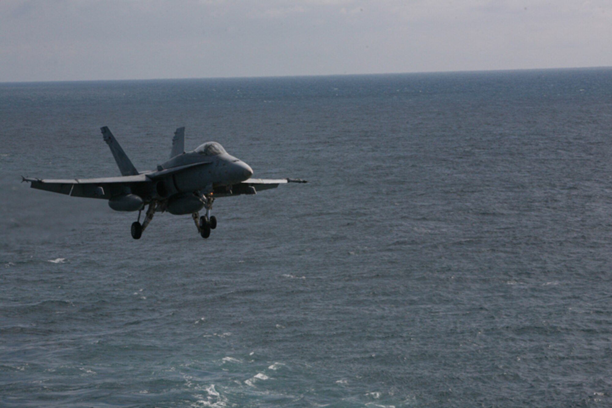 ELMENDORF AIR FORCE BASE, Alaska -- A F/A-18C flown by Navy Strike Fighter Squadron 146 comes in for an arrested carrier landing aboard the USS John C. Stennis (CVN 74) after completing a training mission for Northern Edge 2009 June 23. The Stennis and its nine aircraft squadrons participated in the two-week joint training exercise in Alaska. (U.S. Air Force photo/Marine Corps Sgt. Zachary Dyer)