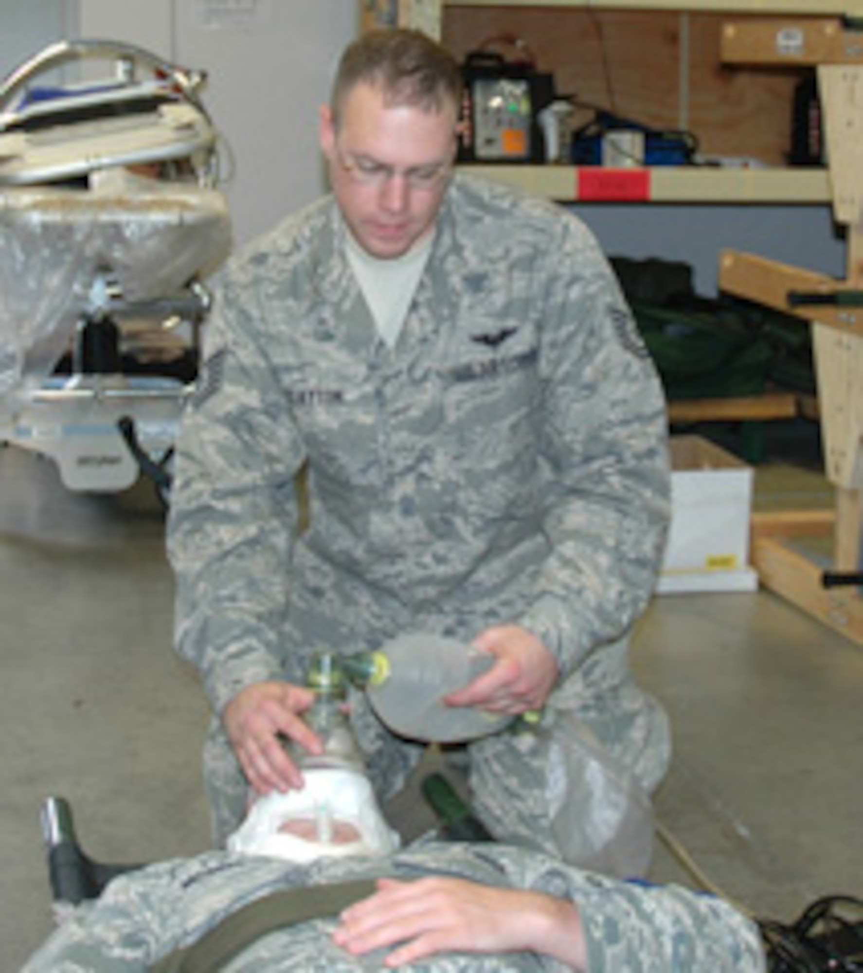 Tech. Sgt. Shawn Clayton, an aerospace evacuation technician with the 446th Aeromedical Evacuation Squadron, performs patient assessment training on fellow Airman Airman 1st Class Patrick Mcgreevey, also with the 446th AES. Sergeant Clayton was recognized as the Noncommissioned Officer of the Exercise, by a panel of Army, Navy, and Air Force board members for his efforts at Global Medic, June 6-18 at Fort McCoy, Wis. 