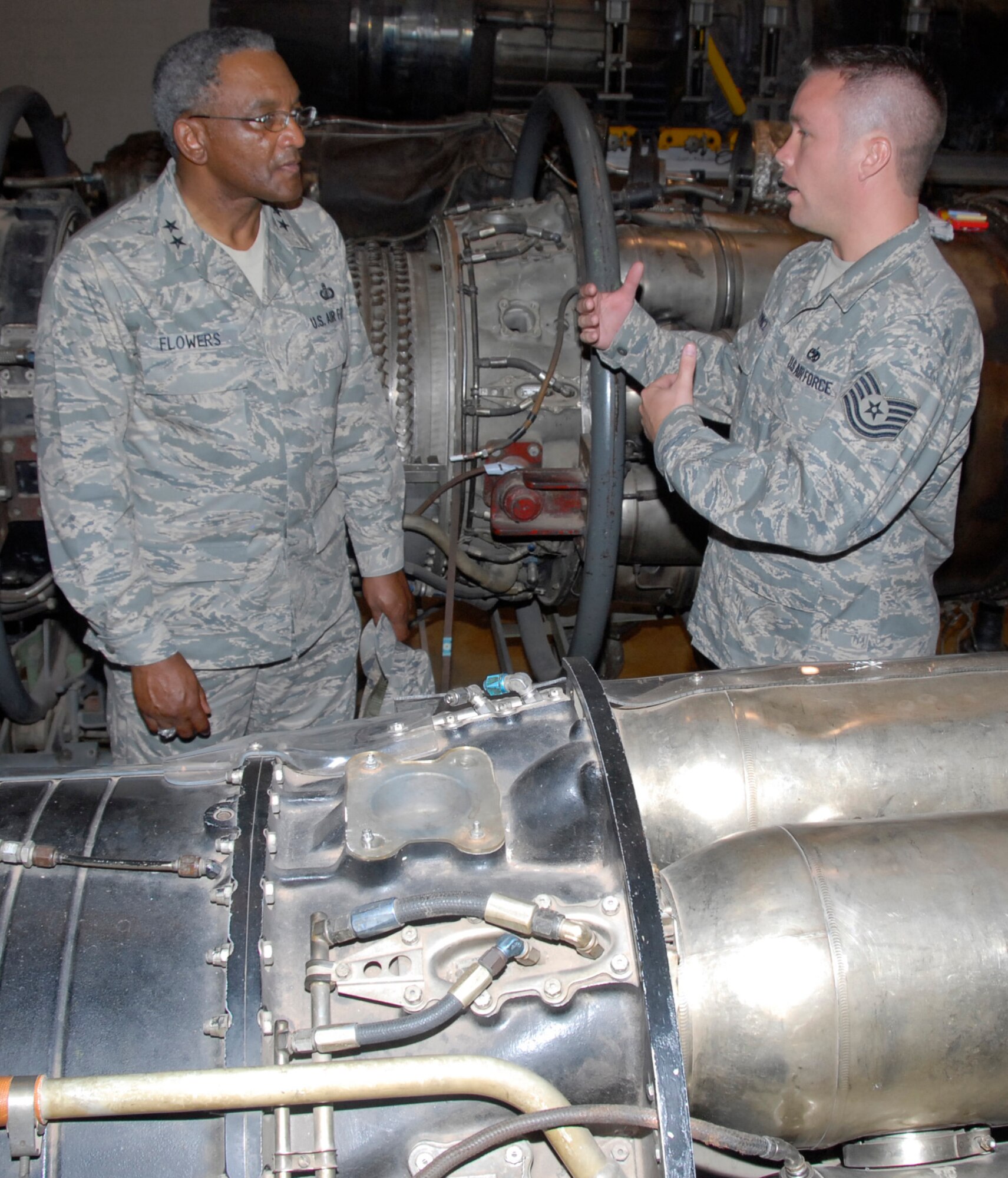Tech. Sgt. Aaron Kiewicz, an instructor at the 361st Training Squadron, talks to 2nd Air Force Commander Maj. Gen. Alfred Flowers June 24 at the squadron's engine shop. The general and Chief Master Sgt. Paul Moreau, command chief master sergeant of 2nd AF, visited Sheppard June 23-25. (U.S. Air Force photo/Harry Tonemah)