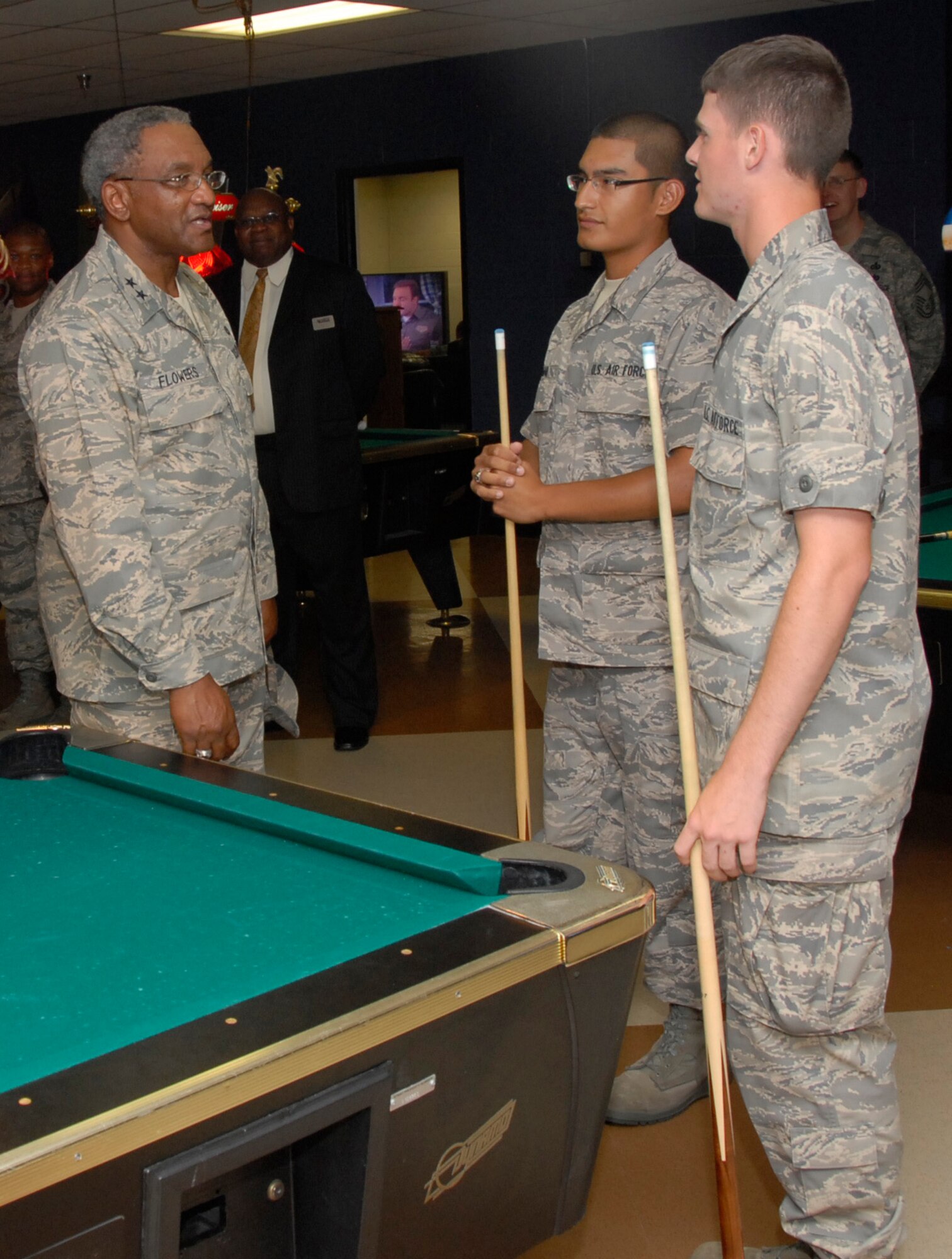 Maj. Gen. Alfred Flowers, left, talks with two Airmen June 24 at The Loft, a permanent party Airmen's club at Sheppard Air Force Base, Texas. The commander of 2nd Air Force and Chief Master Sgt. Paul Moreau, the numbered air force's command chief, visited the base June 23-25. (U.S. Air Force photo/Harry Tonemah)