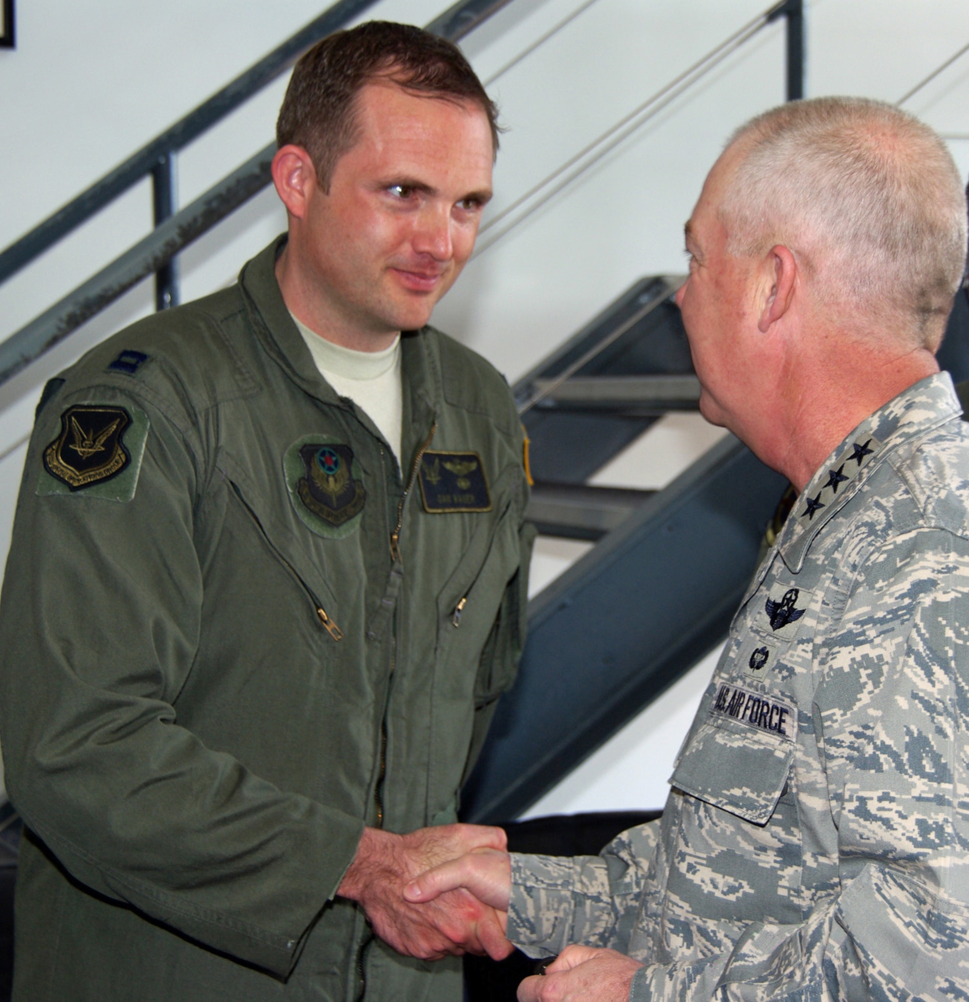 RAF Mildenhall, ENGLAND -- Air Force Special Operations Command Commander Lt. Gen. Donald C. Wurster coins members of the rescue mission including Capt. Dan Bauer, the mission's copilot, during a recent visit to the 352nd
Special Operations Group here. The rescue crew overcame challenging circumstances and played a key role in saving the life of a critically-injured sailor aboard a ship off the Irish coast. (U.S. Air Force photo by Tech. Sgt. Marelise Wood)
