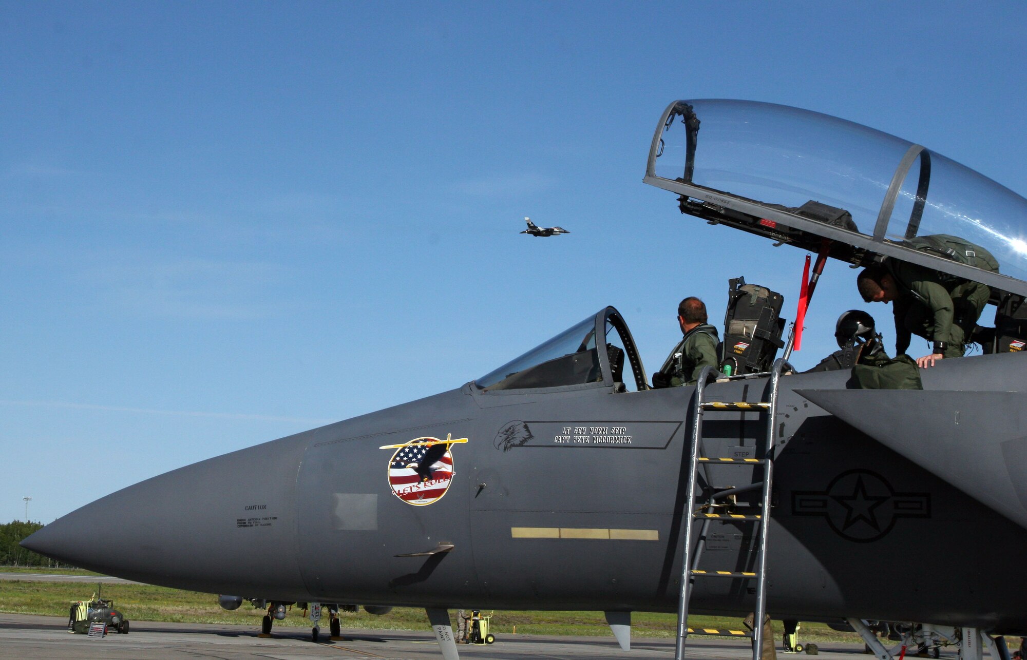EIELSON AFB, Alaska -- An F-15 Strike Eagle from Mountain Home Air Force Base, Idaho, prepares for takeoff here June 16 as another F-15 passes by.  The F-15's are participating in Exercise Northern Edge 2009.
(U.S. Marine Corps photo by Staff Sgt. Andrew Miller)