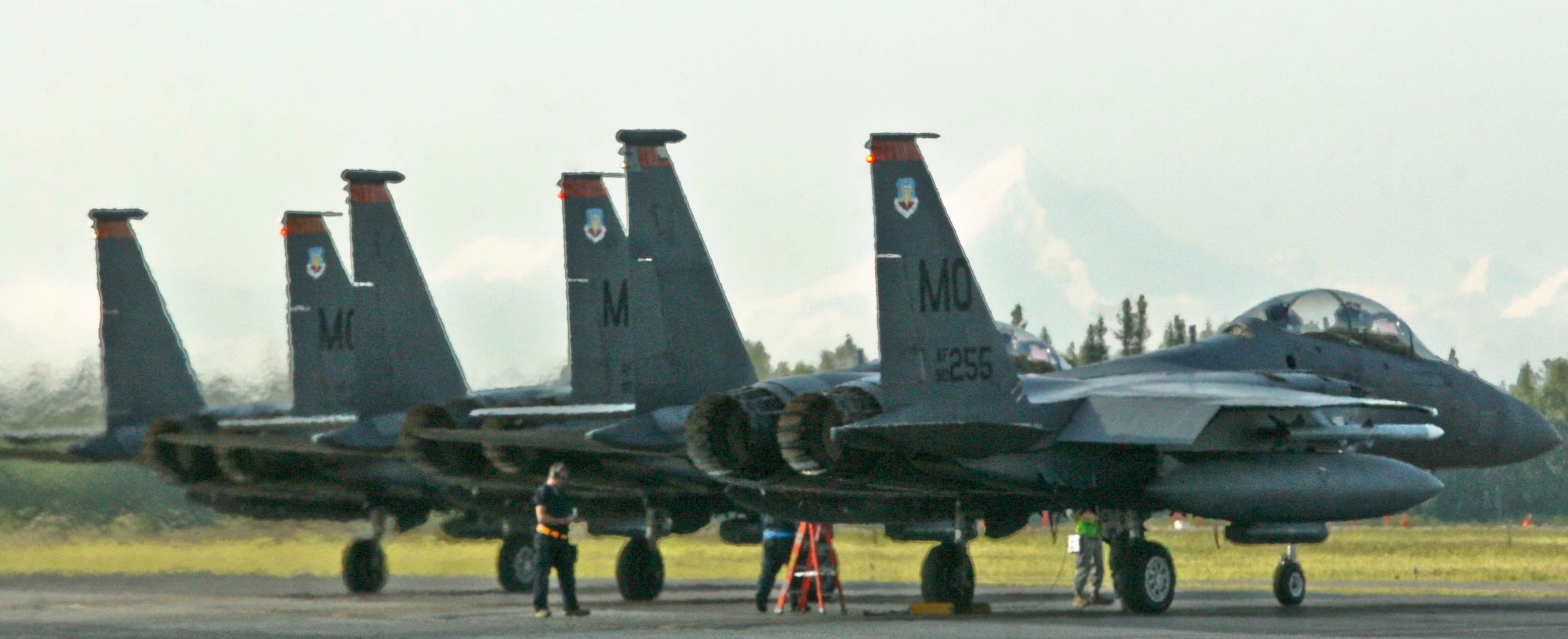 EIELSON AIR FORCE BASE, Alaska - Three F-15 fighter jets from Mountain Home Air Force Base, Idaho, prepare to launch from Eielson's picturesque runway June 25, 2009. The jets were at Eielson in support of Exercise Northern Edge 2009. (U.S. Marine Corps photo by Lance Cpl. Ryan A. Rholes) (Released)