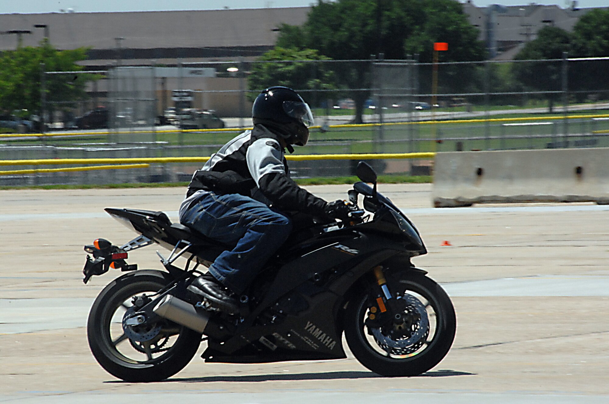 OFFUTT AIR FORCE BASE, Neb. -- Senior Airman Kevin J. Willis, an imagery analyst with the Defense Intelligence Agency, cruises around Offutt's motorcycle range duirng the military sport bike rider course here June 18. The course was designed to give riders the necessary skills to prevent motorcycle mishaps. U.S. Air Force photo by Kendra Williams