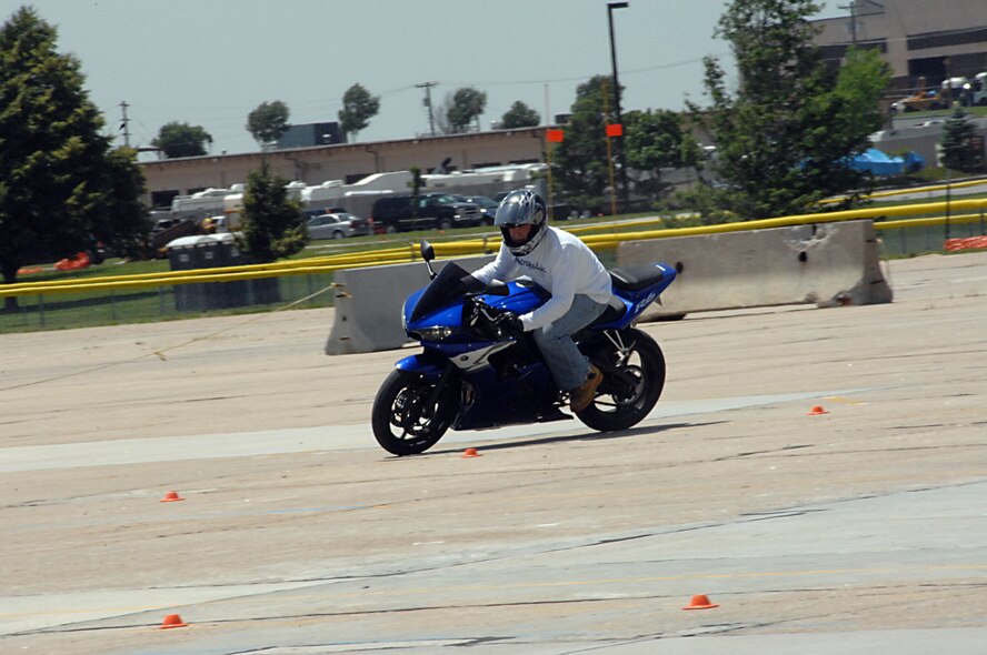 OFFUTT AIR FORCE BASE, Neb. -- Staff Sgt. Justin Carpenter,an Aerospace ground equipment E-4 flying crew chief with the 55th Maintenance Squadron,  executes a turn during Offutt's first military sport bike rider's course here June 18. U.S. Air Force photo by Kendra Williams 