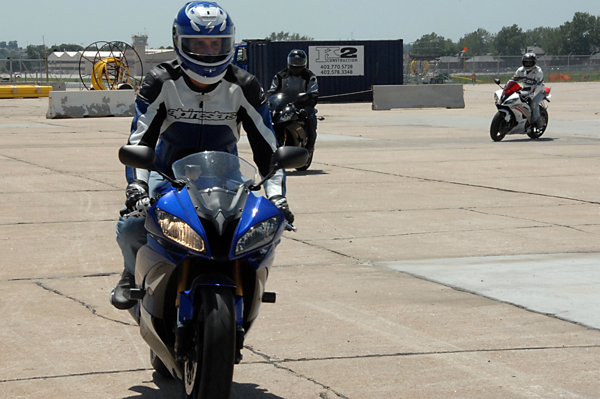 OFFUTT AIR FORCE BASE, Neb. -- Several riders exit the motorcycle training course here after completing numerous exercises during the military sport bike class June 18. The course is designed to give riders the skills necessary to prevent motorcycle mishaps. U.S. Air Force photo by Kendra Williams