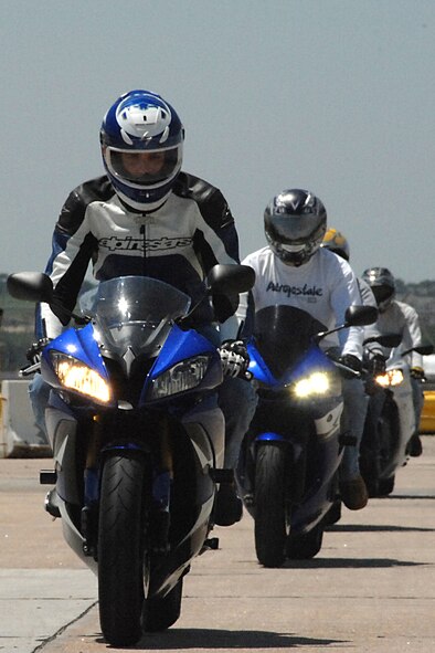 OFFUTT AIR FORCE BASE, Neb. -- Several motorcycle riders head out to the motorcycle range here during the military sport bike rider course June 18, 2009. the course was designed to give riders the necessary skills to prevent motorcycle mishaps. Master Sgt. Steven W. Flamming, 55th Security Forces Squadron, asks all motorists to be extra cautious when driving near motorcyclists. U.S. Air Force photo by Kendra Williams 
