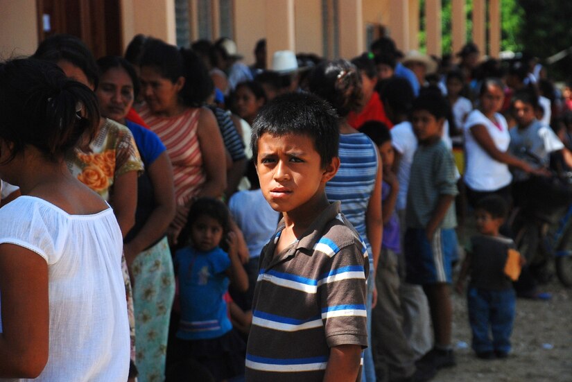 POPTUN, Guatemala -- A Guatemalan boy stands in line with hundreds of other residents of the Poptun area, awaiting treatment at the Brazos de Amor community center here. Twenty-three members of Joint Task Force-Bravo, based at Soto Cano Air Base, Honduras, provided medical care to more than 1,200 people during the first three days of a five-day medical readiness and training exercise. (U.S. Air Force photo/Tech. Sgt. Mike Hammond)
