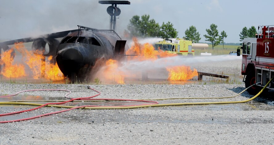MOODY AIR FORCE BASE, Ga. -- Airmen from the 23rd Civil Engineer Squadron 
Fire Department utilize a striker truck to put out a fire caused by a simulated HC-130P crash here June 25. The 23rd CES was required to respond to the fire within a reasonable amount of time. (U.S. Air Force photo by Airman 1st Class Joshua Green)
