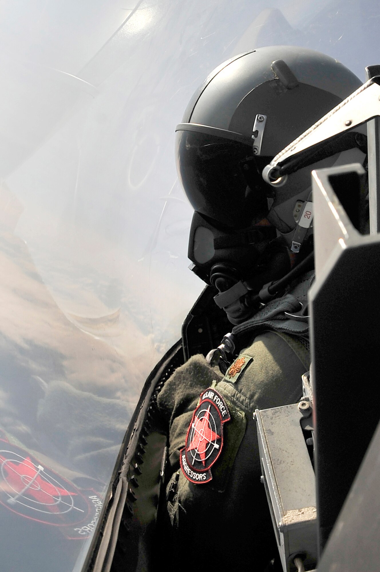 EIELSON AIR FORCE BASE, Alaska -- Maj. Todd Hale looks through the canopy of an F-16 while flying over the Joint Pacific Alaska Range Complex during NORTHERN EDGE 2009, June 25. NE09 participants practice tactics, techniques, and procedures associated with defensive counter-air, close air support, and personnel-recovery missions. Major Hale is an F-16 pilot assigned to the 18th Aggressor Squadron, Eielson AFB, Alaska. (U.S. Air Force photo/Staff Sgt. Christopher Boitz)