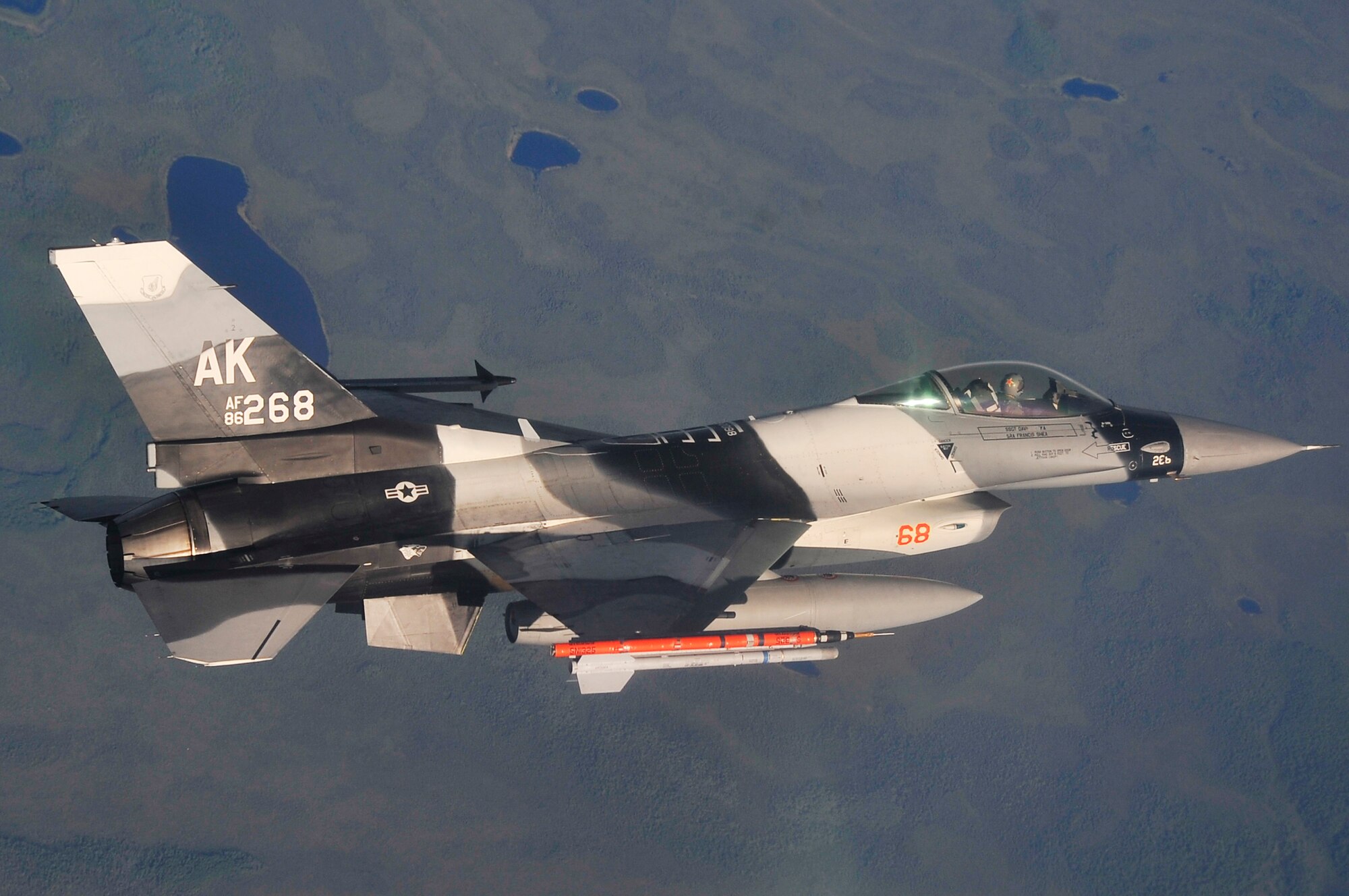 EIELSON AIR FORCE BASE, Alaska -- An F-16 Aggressor passes over the Joint Pacific Alaska Range Complex during NORTHERN EDGE 2009, June 25. NE09 participants practice tactics, techniques, and procedures associated with defensive counter-air, close air support, and personnel-recovery missions. The F-16 is assigned to the 18th Aggressor Squadron, Eielson AFB, Alaska. (U.S. Air Force photo/Staff Sgt. Christopher Boitz)