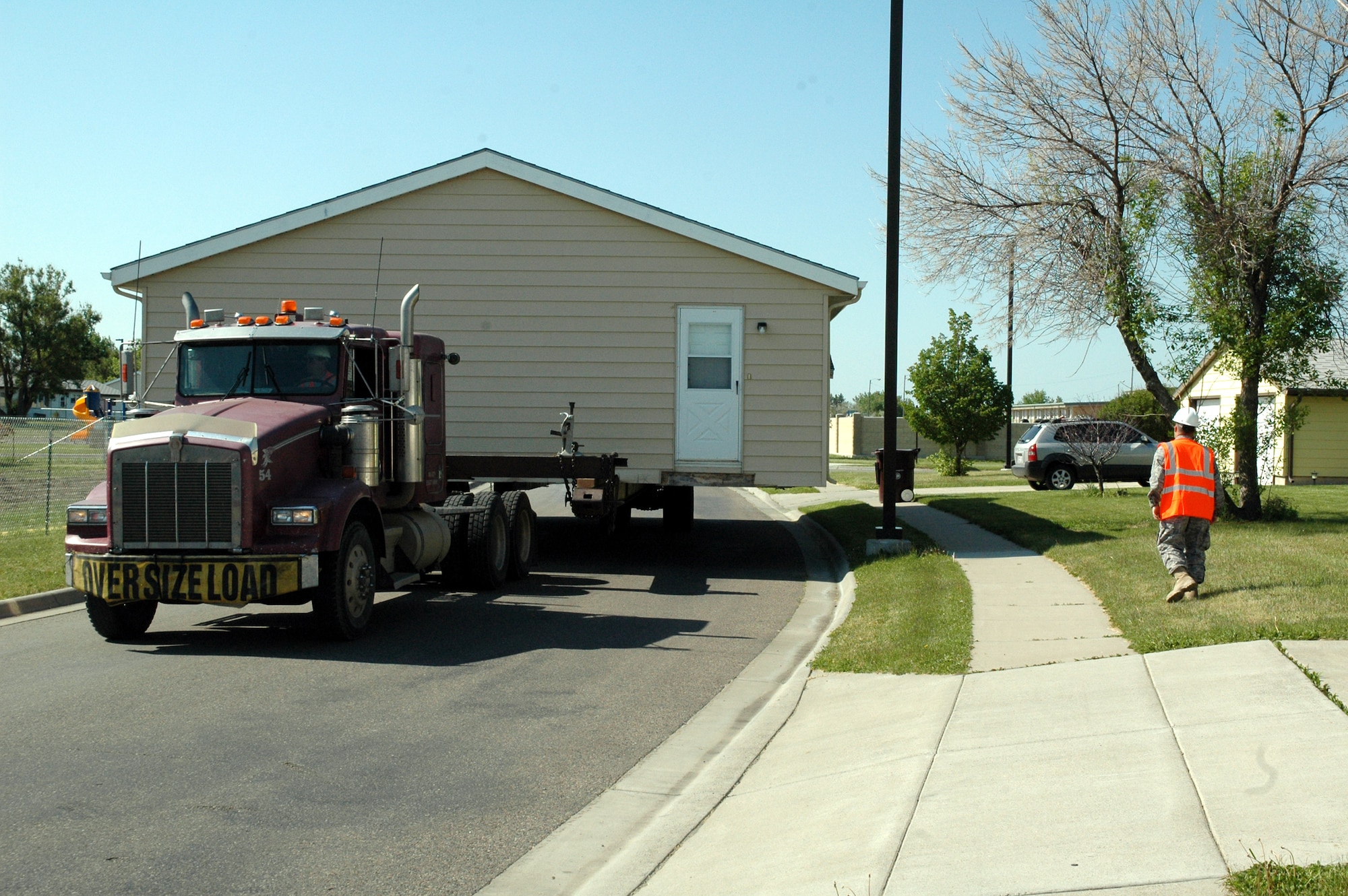 One of 14 housing units at Malmstrom Air Force Base that will be donated to American Indian Tribes in Montana begins its journey to its new location June 8. Since 1999, Malmstrom has transferred 230 excess military family housing units to Operation Walking Shield. (U.S. Air Force photo/Senior Airman Dillon White) 