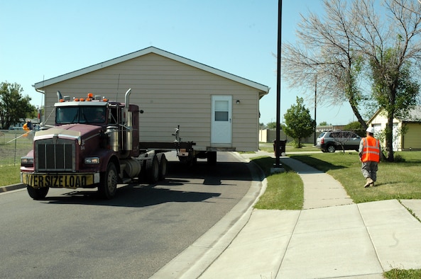 One of 14 housing units at Malmstrom Air Force Base that will be donated to American Indian Tribes in Montana begins its journey to its new location June 8. Since 1999, Malmstrom has transferred 230 excess military family housing units to Operation Walking Shield. (U.S. Air Force photo/Senior Airman Dillon White) 