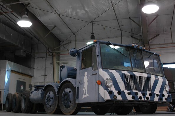 The 1962 transporter erector that has been on display at the Malmstrom Museum since 1991 is now parked at the 341st Logistics Readiness Squadron allied trades shop where the staff will disassemble, sand and repaint it when they have extra time. (U.S. Air Force photo/Senior Airman Dillon White)