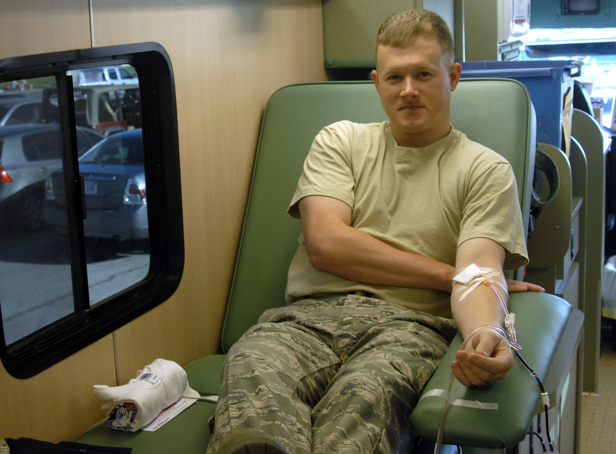 Giving blood at the United Blood Services Bloodmobile on Goodfellow Air Force Base Wednesday is Staff Sgt. Bryan Massey, a student with the 316th Training Squadron. The bloodmobile visits each unit on base on a predetermined schedule, so that Soldiers, Sailors, Airmen and Marines can give blood every two months. For more information, contact your first sergeant. (U.S. Air Force photo by Senior Airman Stephen Musal)